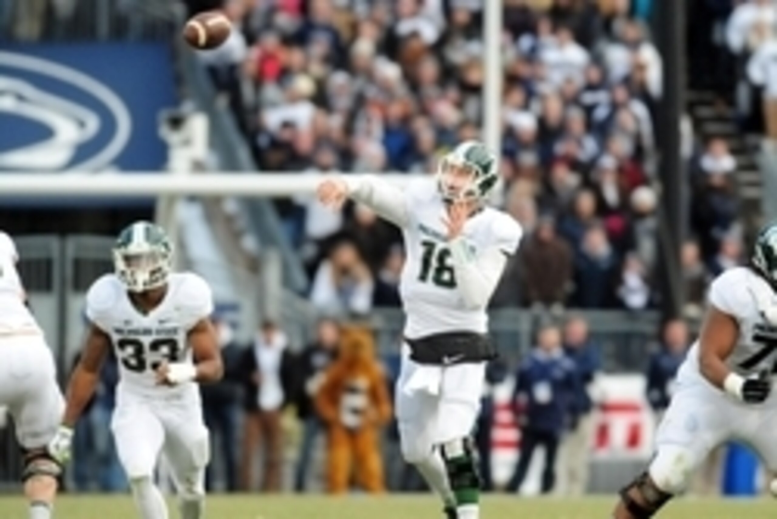 Nov 29, 2014; University Park, PA, USA; Michigan State Spartans quarterback Connor Cook (18) throws a pass in the first quarter against the Penn State Nittany Lions at Beaver Stadium. Mandatory Credit: Evan Habeeb-USA TODAY Sports