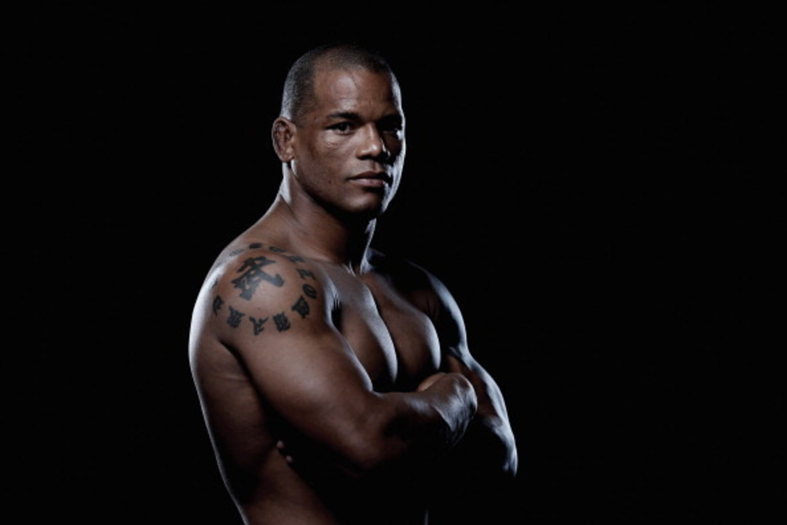 BRISBANE, AUSTRALIA - DECEMBER 06:  (EDITORS NOTE: Image has been desaturated) Hector Lombard poses during a UFC portrait session on December 6, 2013 in Brisbane, Australia.  (Photo by Chris Hyde/Getty Images)