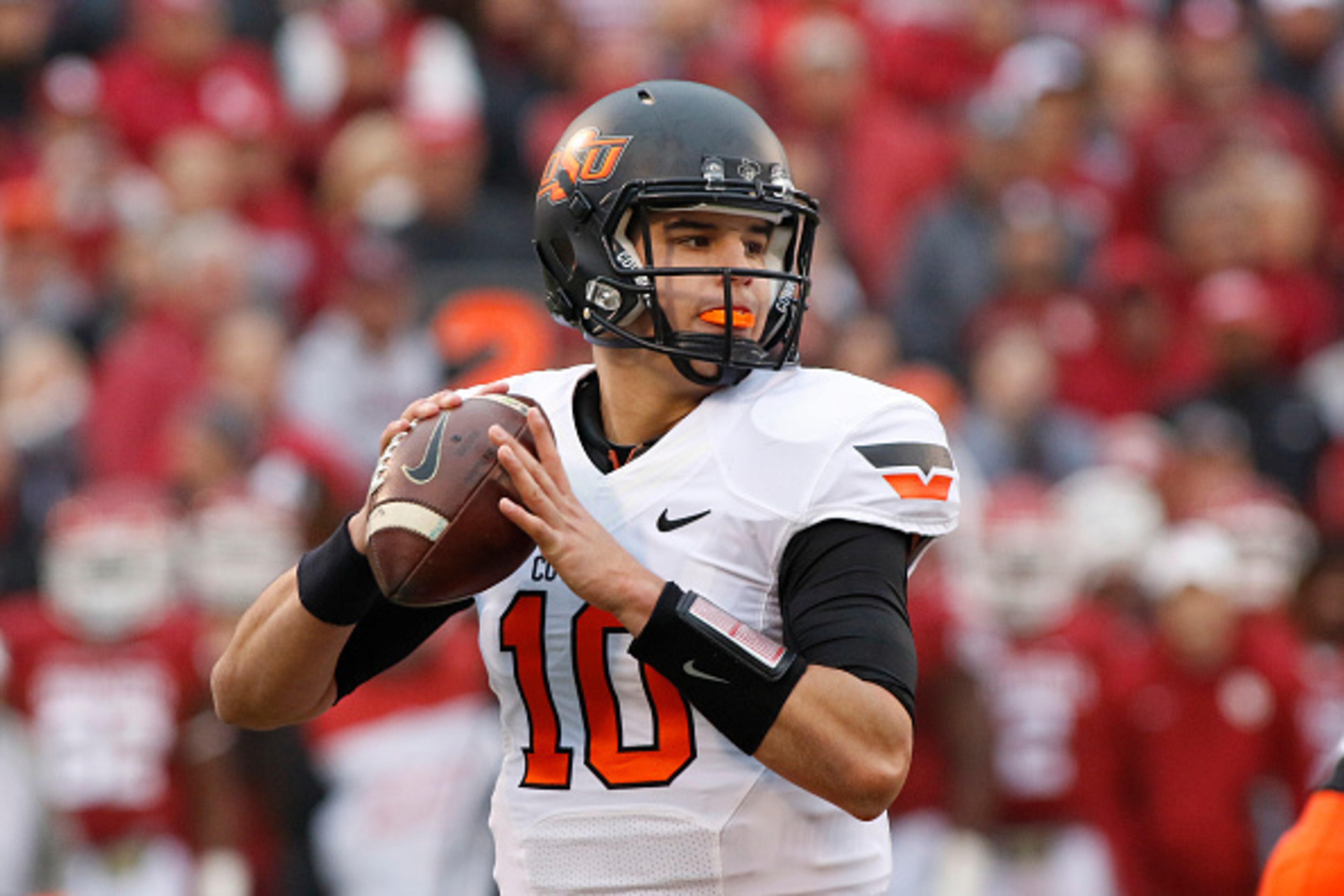 NORMAN, OK - DECEMBER 6: Quarterback Mason Rudolph #10 of the Oklahoma State Cowboys looks to throw against the Oklahoma Sooners December 6, 2014 at Gaylord Family-Oklahoma Memorial Stadium in Norman, Oklahoma. The Cowboys defeated the Sooners 38-35 in o NORMAN, OK - DECEMBER 6: Quarterback Mason Rudolph #10 of the Oklahoma State Cowboys looks to throw against the Oklahoma Sooners December 6, 2014 at Gaylord Family-Oklahoma Memorial Stadium in Norman, Oklahoma. The Cowboys defeated the Sooners 38-35 in o
