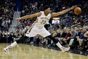 Dec 30, 2014; New Orleans, LA, USA; New Orleans Pelicans forward Anthony Davis (23) saves a loose ball during the first quarter of a game against the Phoenix Suns at Smoothie King Center. Mandatory Credit: Derick E. Hingle-USA TODAY Sports
