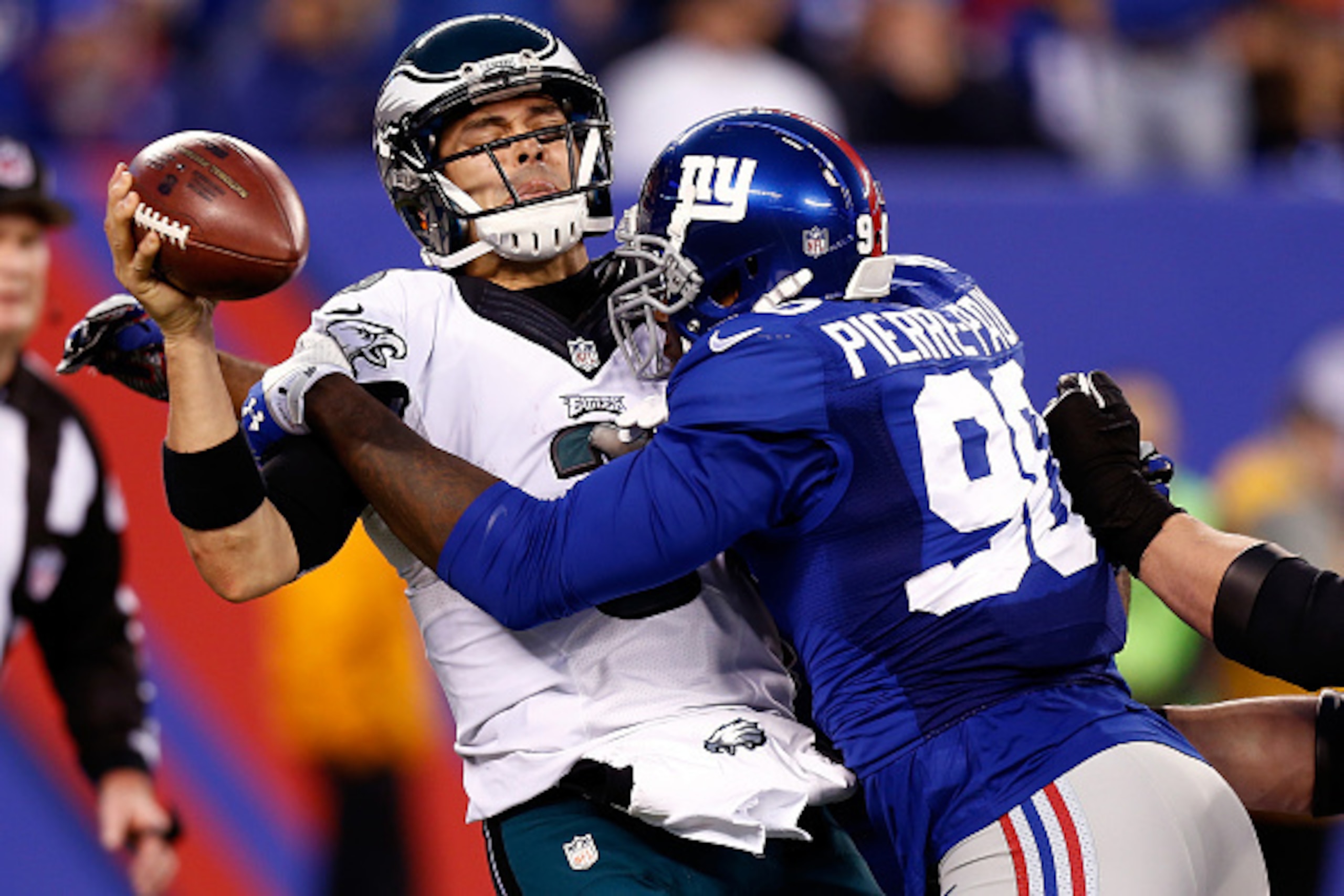 EAST RUTHERFORD, NJ - DECEMBER 28:  Jason Pierre-Paul #90 of the New York Giants sacks Mark Sanchez #3 of the Philadelphia Eagles during a game at MetLife Stadium on December 28, 2014 in East Rutherford, New Jersey.  (Photo by Jeff Zelevansky/Getty Images