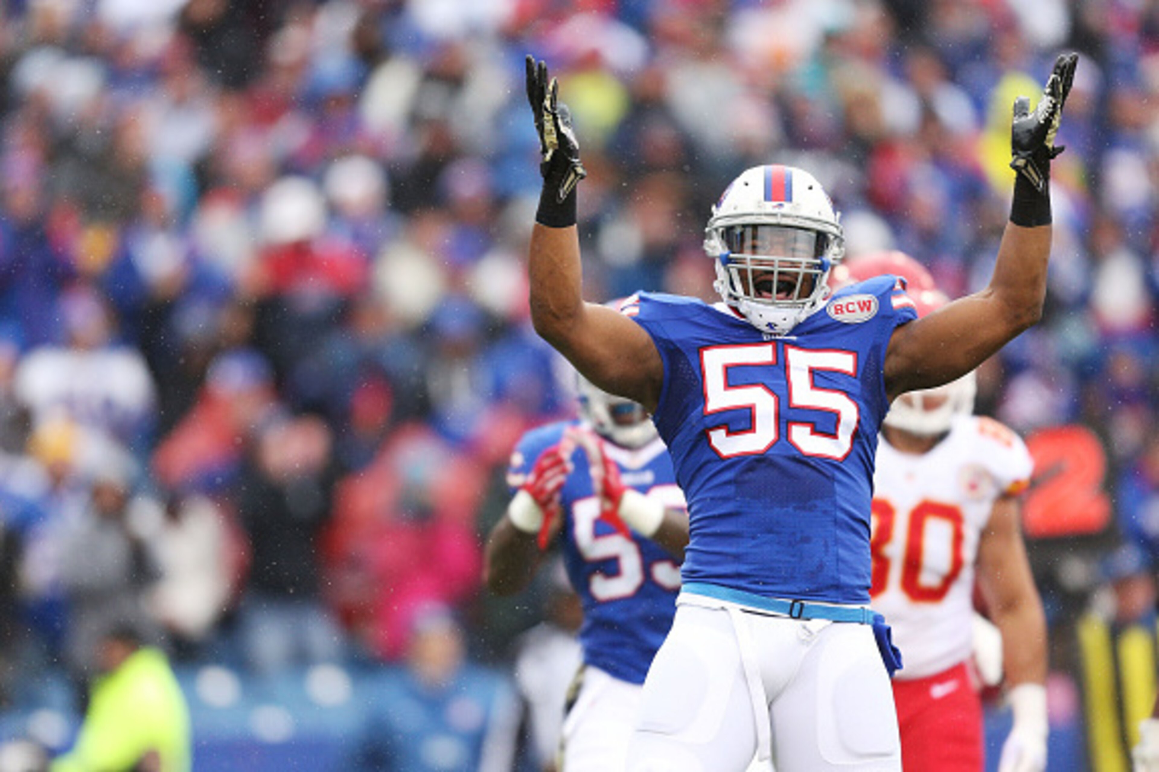 ORCHARD PARK, NY - NOVEMBER 09:   Jerry Hughes #55 of the Buffalo Bills celebrates a tackle for a loss against the Kansas City Chiefs during the first half at Ralph Wilson Stadium on November 9, 2014 in Orchard Park, New York.  (Photo by Brett Carlsen/Get