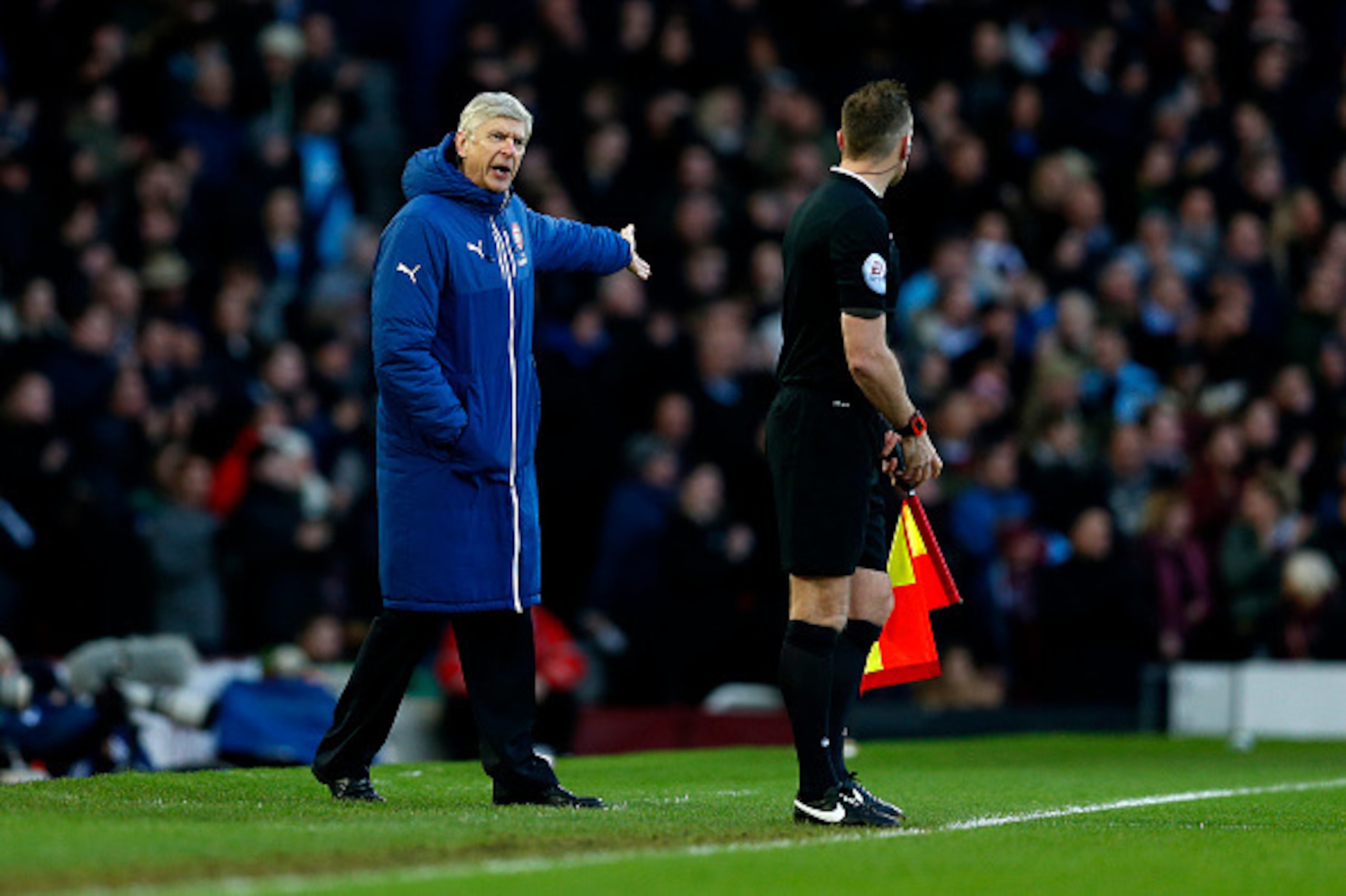 LONDON, ENGLAND - DECEMBER 28:  Arsene Wenger, manager of Arsenal shouts at assistant referee Scott Ledger during the Barclays Premier League match between West Ham United and Arsenal at Boleyn Ground on December 28, 2014 in London, England.  (Photo by St