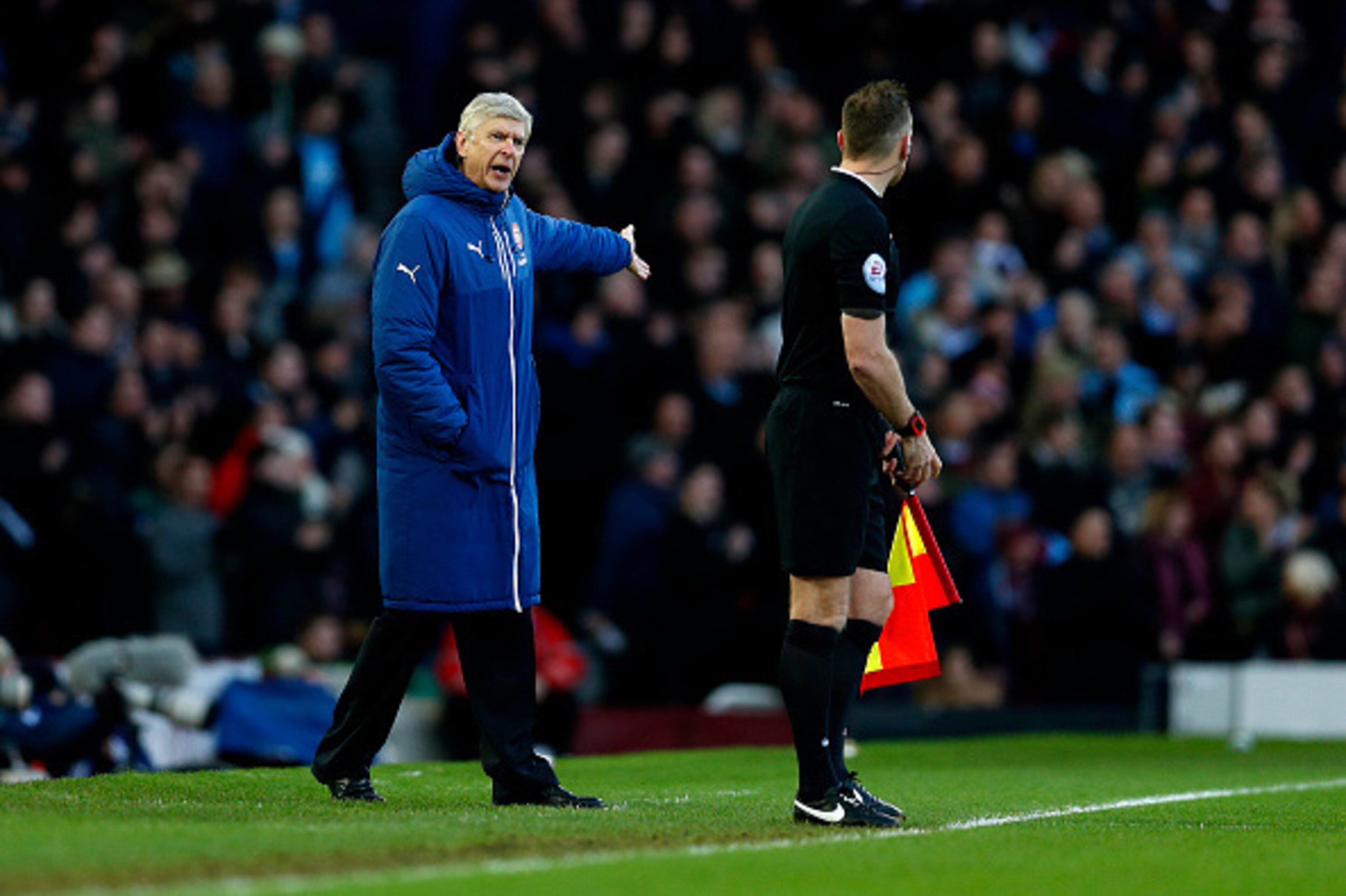 LONDON, ENGLAND - DECEMBER 28:  Arsene Wenger, manager of Arsenal shouts at assistant referee Scott Ledger during the Barclays Premier League match between West Ham United and Arsenal at Boleyn Ground on December 28, 2014 in London, England.  (Photo by St