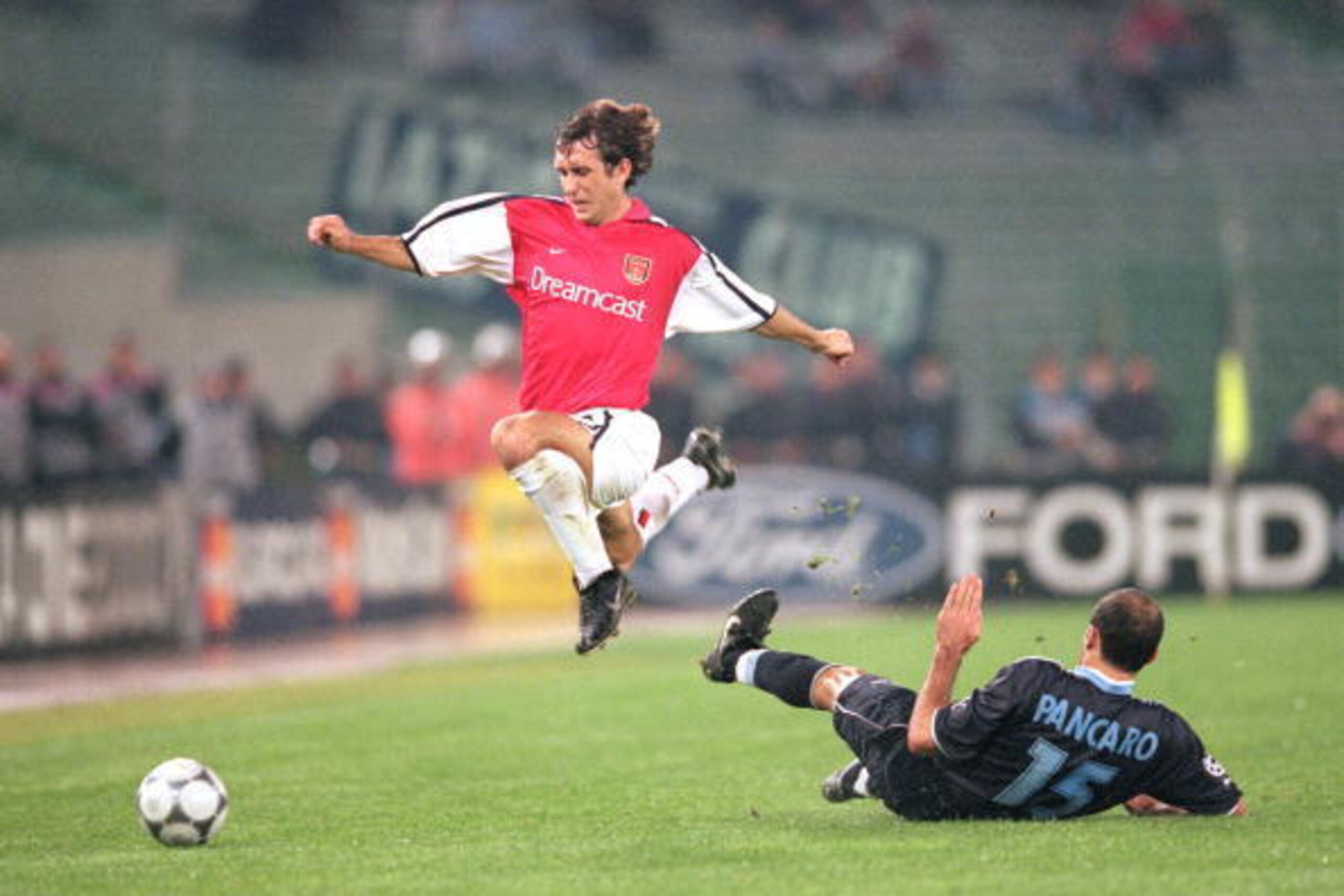17 Oct 2000:  Gilles Grimandi of Arsenal skips past Giuseppe Pancaro of Lazio during the UEFA Champions League match played at the Olympic Stadium, in Rome, Italy. The match ended in a 1-1 draw. \ Mandatory Credit: Clive Brunskill /Allsport