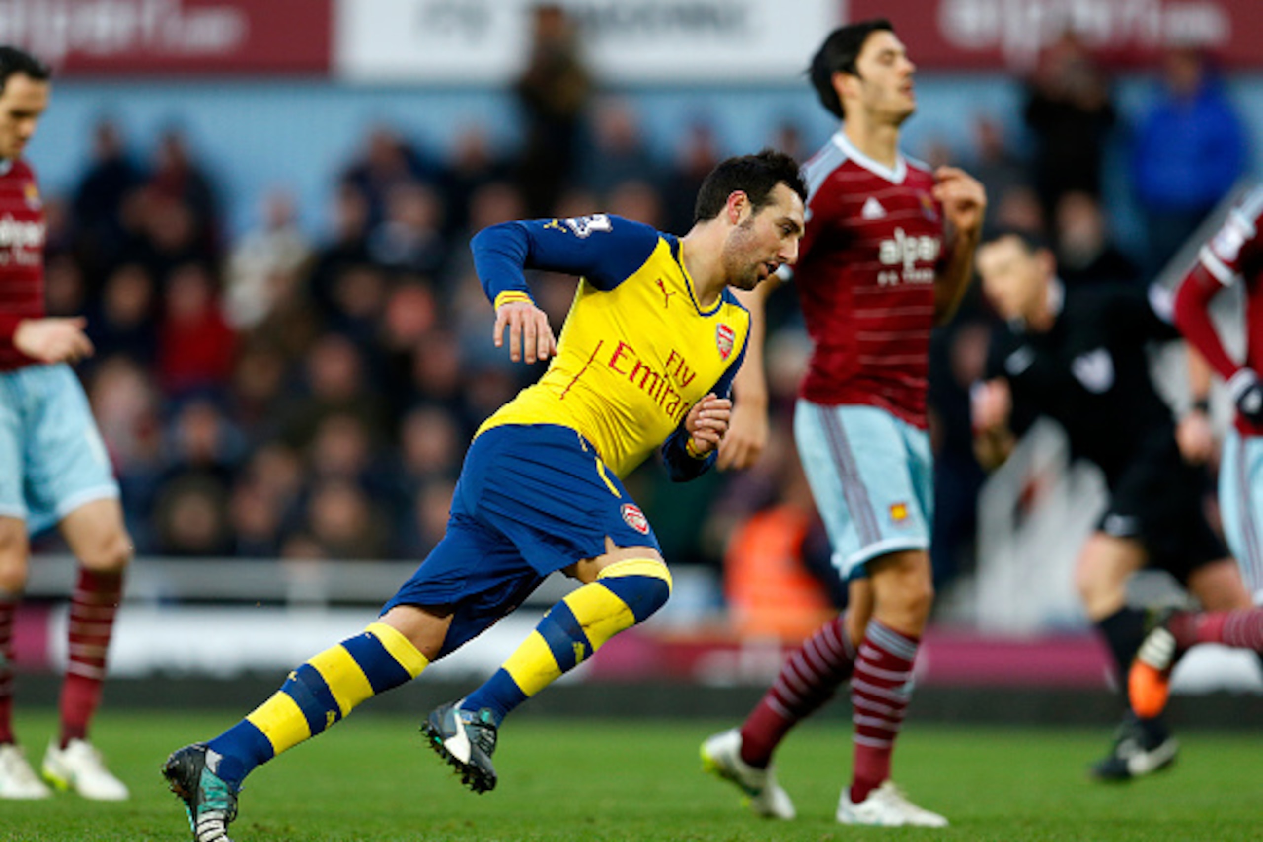 LONDON, ENGLAND - DECEMBER 28: Santi Cazorla of Arsenal celebrates after scoring the opening goal from the penalty spot during the Barclays Premier League match between West Ham United and Arsenal at Boleyn Ground on December 28, 2014 in London, England. LONDON, ENGLAND - DECEMBER 28: Santi Cazorla of Arsenal celebrates after scoring the opening goal from the penalty spot during the Barclays Premier League match between West Ham United and Arsenal at Boleyn Ground on December 28, 2014 in London, England.