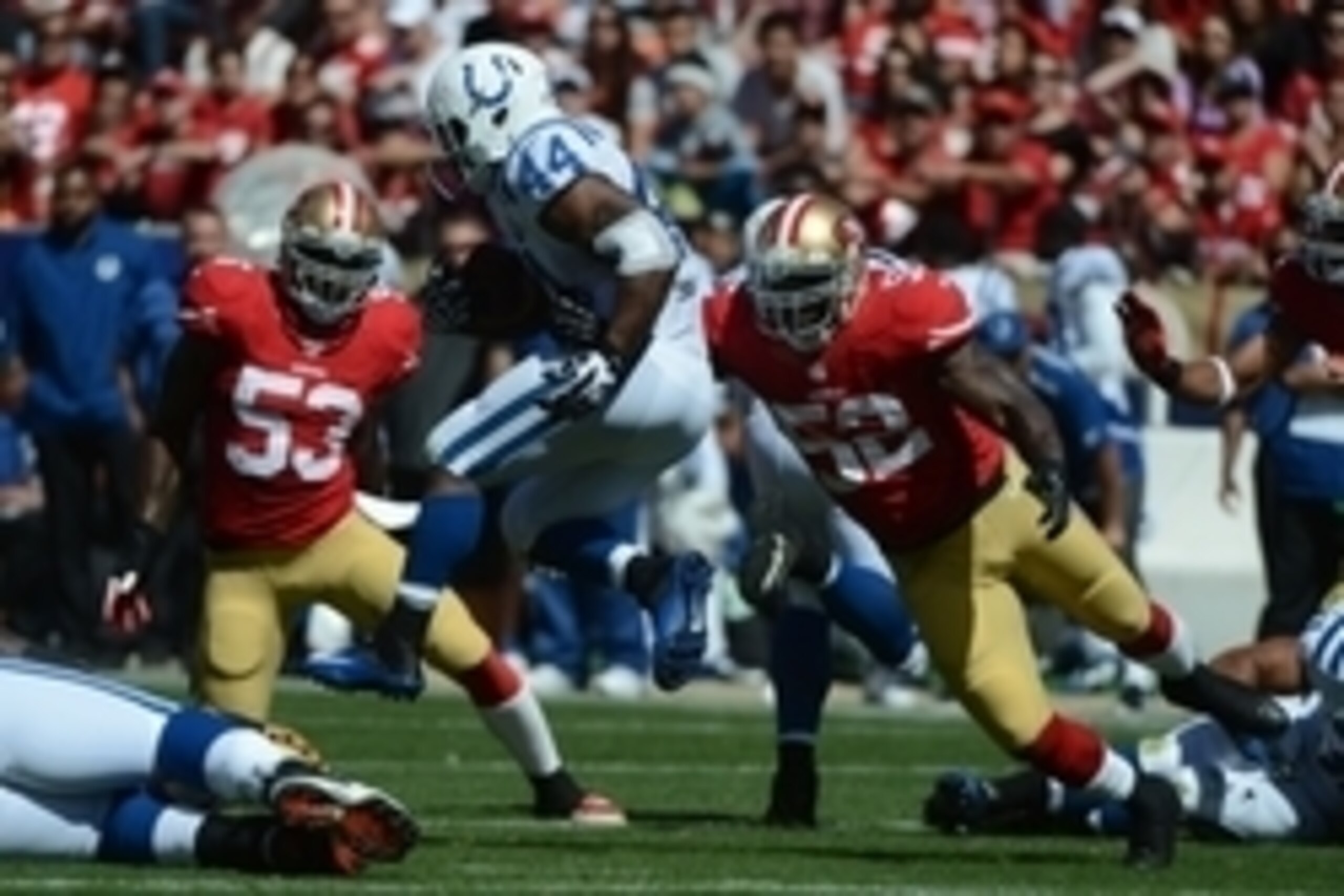 September 22, 2013; San Francisco, CA, USA; Indianapolis Colts running back Ahmad Bradshaw (44) runs against San Francisco 49ers inside linebacker NaVorro Bowman (53) and inside linebacker Patrick Willis (52) during the first quarter at Candlestick Park. 