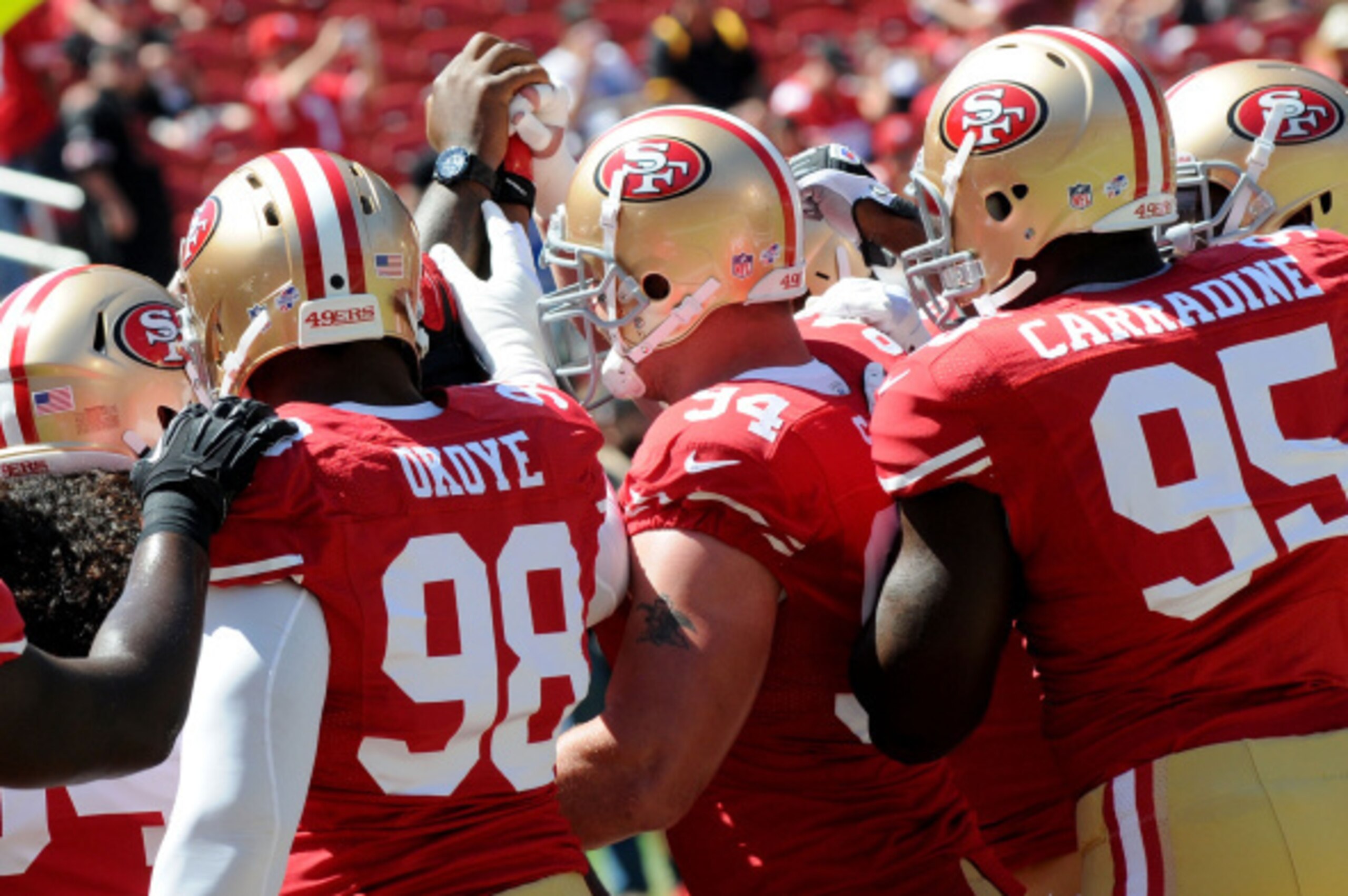 SANTA CLARA, CA - AUGUST 24:  Defensive end Lawrence Okoye #98 of the San Francisco 49ers in the huddle before the preseason game against the San Diego Chargers at Levi's Stadium on August 24, 2014 in Santa Clara, California.  (Photo by Noah Graham/Getty 