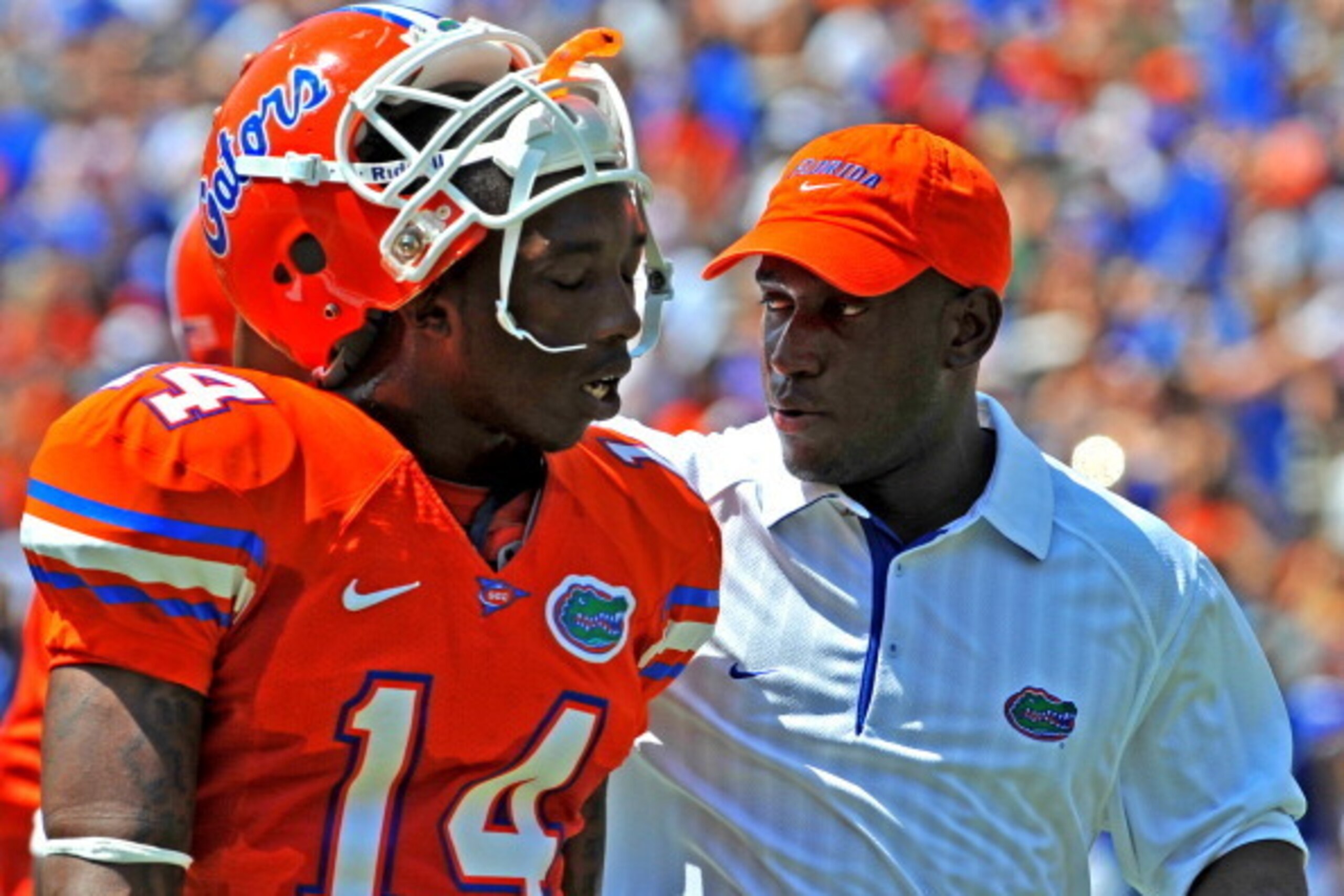 GAINESVILLE, FL - APRIL 9:  Defensive backs coach Travaris Robinson of the Florida Gators talks with cornerback Jaylen Watkins #14 during the Orange and Blue spring football game April 9, 2011 Ben Hill Griffin Stadium at Gainesville, Florida.  (Photo by A