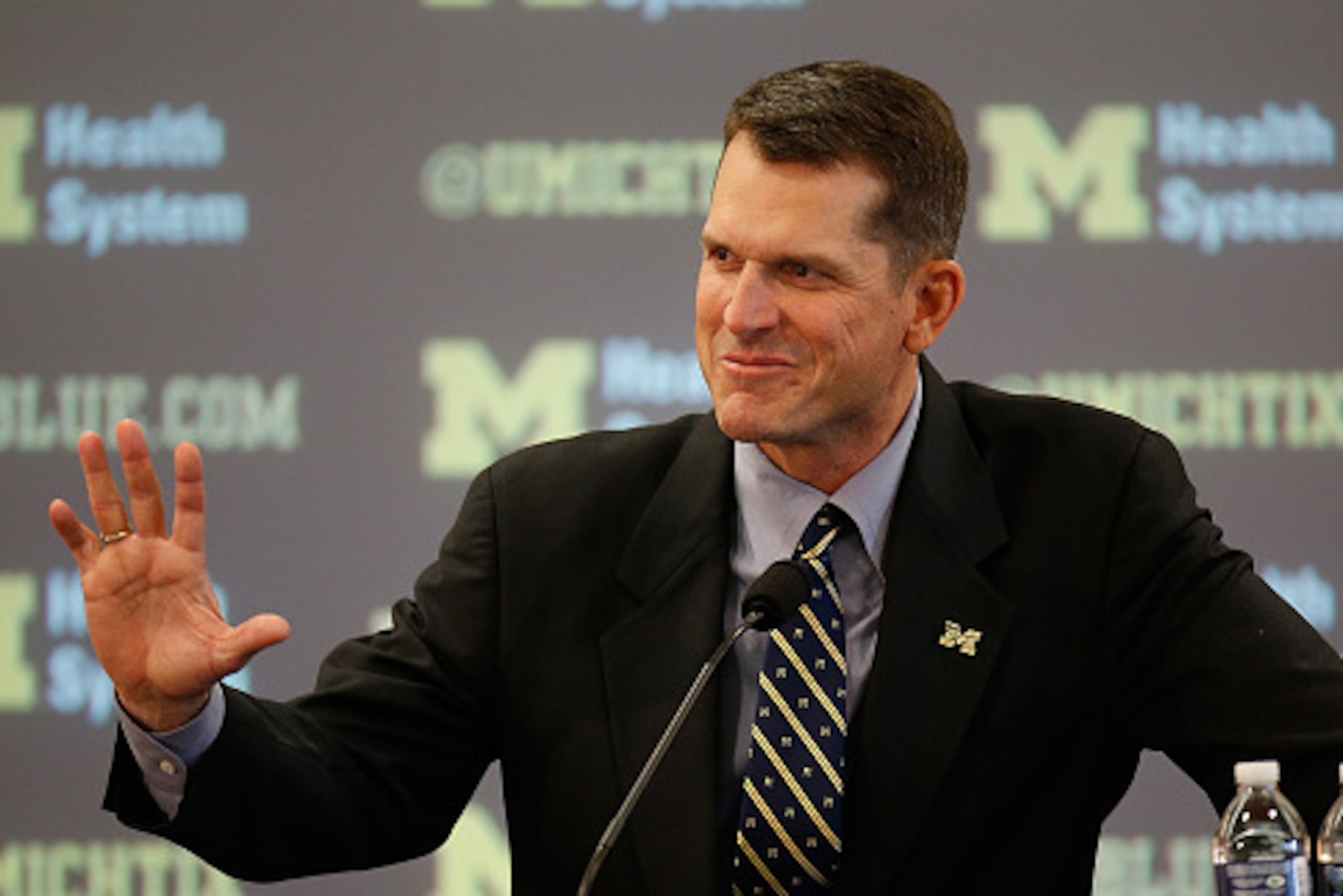ANN ARBOR, MI - DECEMBER 30:  Jim Harbaugh speaks as he is introduced as the new Head Coach of the University of Michigan football team at the Junge Family Champions Center on December 30, 2014 in Ann Arbor, Michigan.  (Photo by Gregory Shamus/Getty Image
