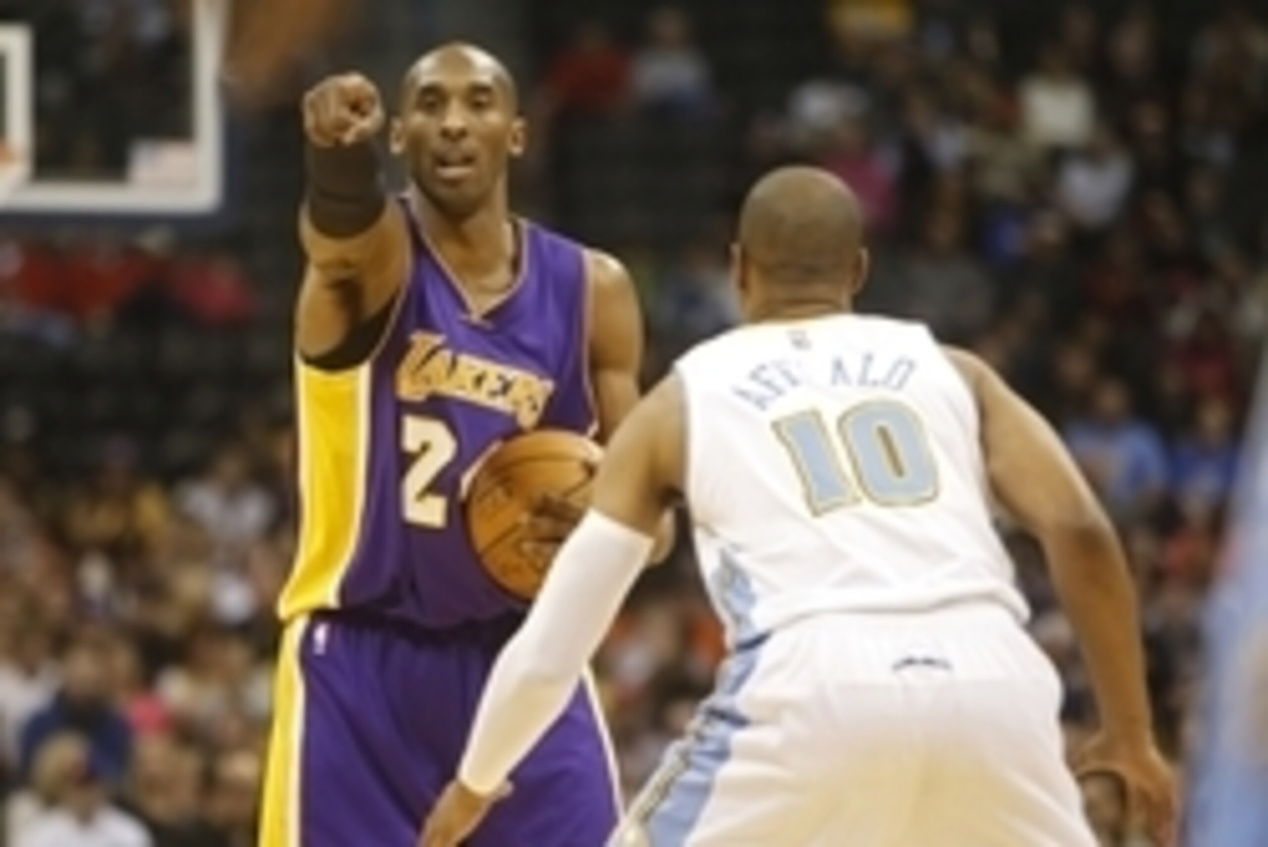 Dec 30, 2014; Denver, CO, USA; Los Angeles Lakers guard Kobe Bryant (24) directs his team during the first half against the Denver Nuggets at Pepsi Center. Mandatory Credit: Chris Humphreys-USA TODAY Sports Dec 30, 2014; Denver, CO, USA; Los Angeles Lakers guard Kobe Bryant (24) directs his team during the first half against the Denver Nuggets at Pepsi Center. Mandatory Credit: Chris Humphreys-USA TODAY Sports