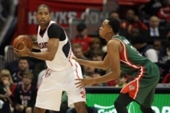 Dec 26, 2014; Atlanta, GA, USA; Atlanta Hawks center Al Horford (15) is defended by Milwaukee Bucks center John Henson (31) in the second quarter at Philips Arena. Mandatory Credit: Brett Davis-USA TODAY Sports