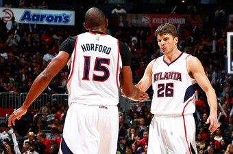 ATLANTA, GA - DECEMBER 15:  Al Horford #15 of the Atlanta Hawks reacts with Kyle Korver #26 after drawing a foul against the Chicago Bulls at Philips Arena on December 15, 2014 in Atlanta, Georgia.  NOTE TO USER: User expressly acknowledges and agrees tha