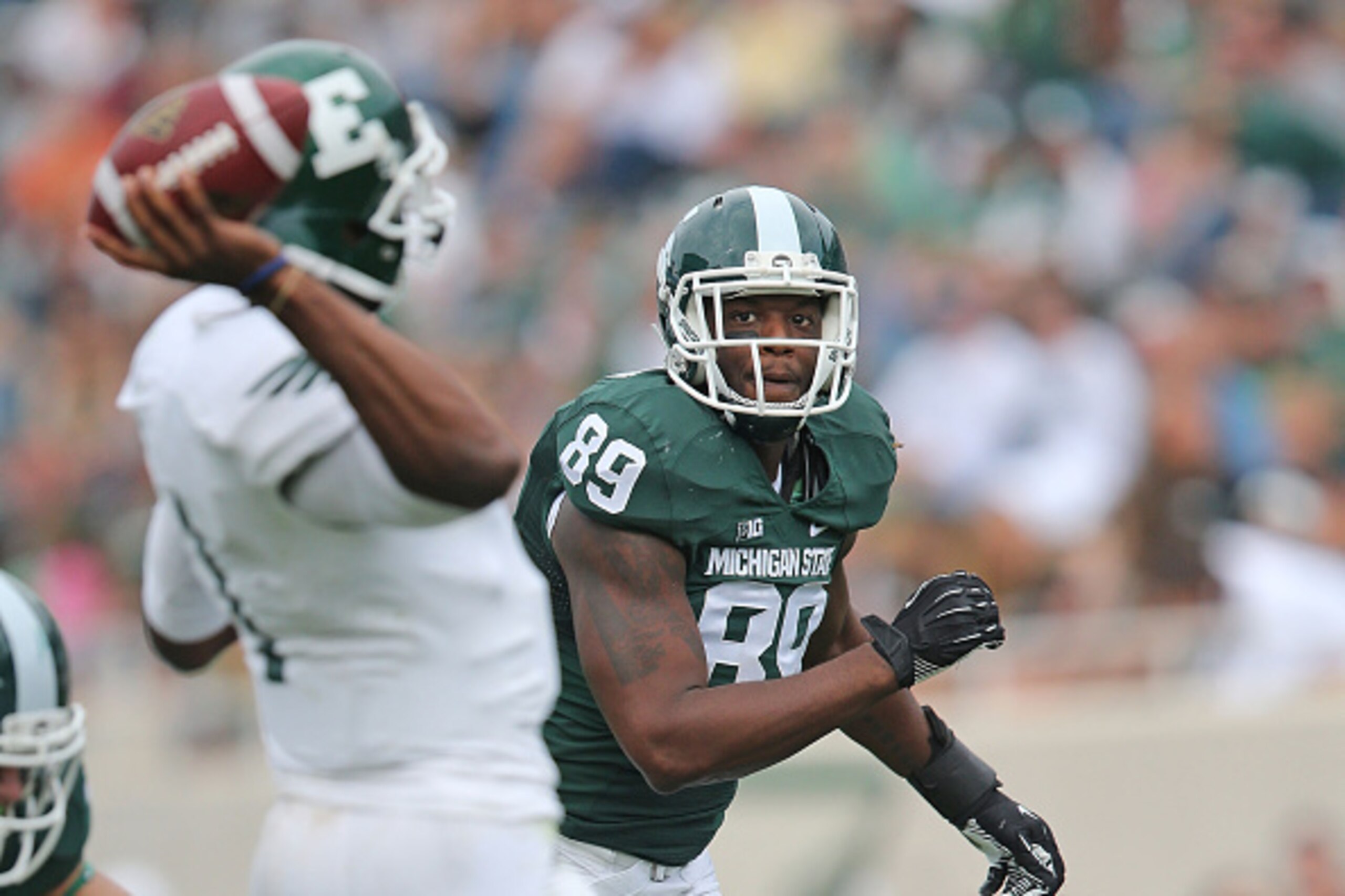 EAST LANSING, MI - SEPTEMBER 20:  Shilique Calhoun #89 of the Michigan State Spartans rushes the quarterbeack during the second quarter of the game against Eastern Michigan Eagles at Spartan Stadium on September 20, 2014 in East Lansing, Michigan. Michiga