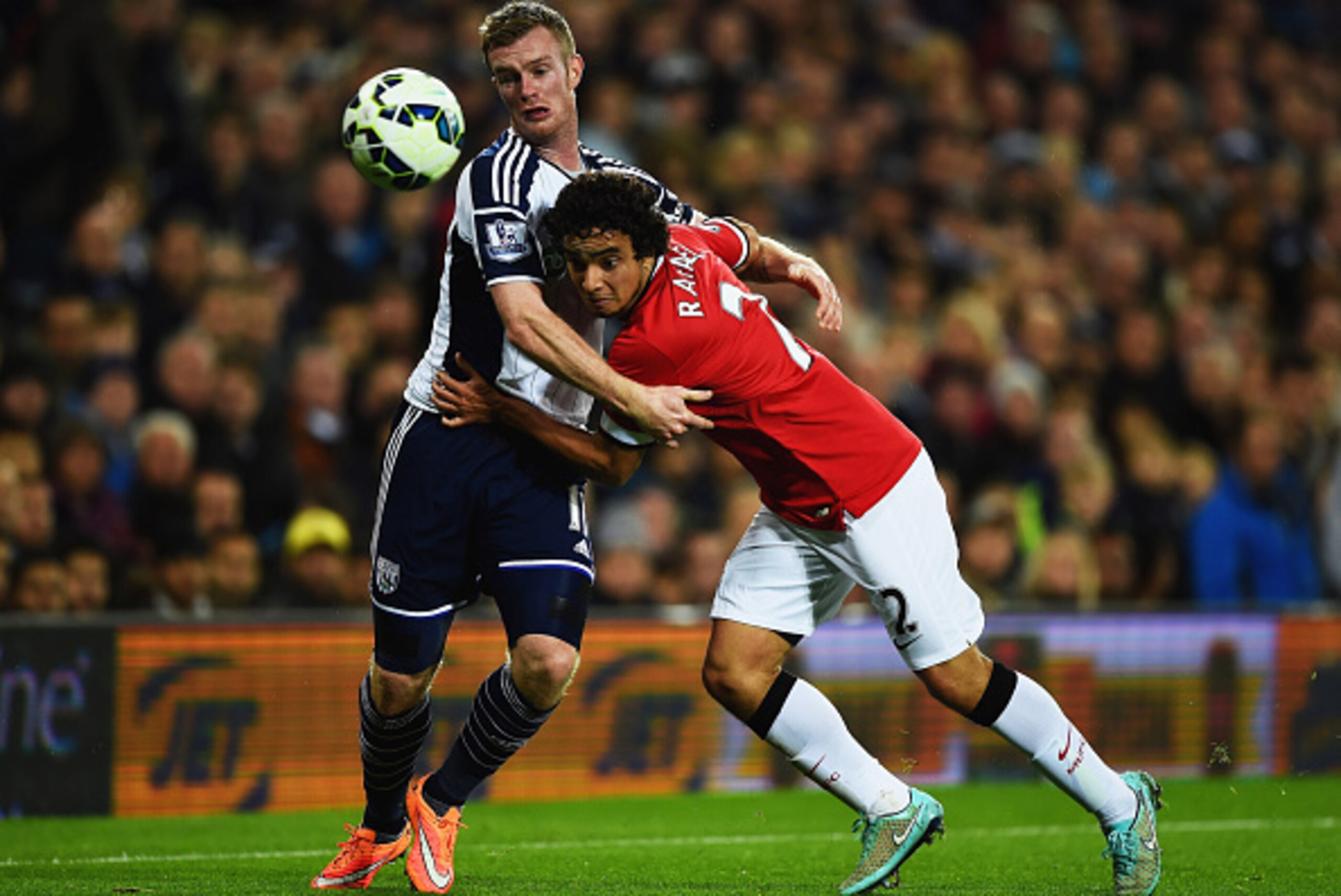 WEST BROMWICH, ENGLAND - OCTOBER 20: Rafael of Manchester United and Chris Brunt of West Bromwich Albion watch the ball during the Barclays Premier League match between West Bromwich Albion and Manchester United at The Hawthorns on October 20, 2014 in We WEST BROMWICH, ENGLAND - OCTOBER 20: Rafael of Manchester United and Chris Brunt of West Bromwich Albion watch the ball during the Barclays Premier League match between West Bromwich Albion and Manchester United at The Hawthorns on October 20, 2014 in We