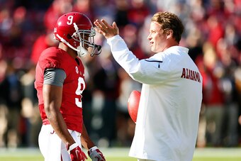 TUSCALOOSA, AL - NOVEMBER 15:  Offensive Coordinator Lane Kiffin of the Alabama Crimson Tide converses with Amari Cooper #9 prior to facing the Mississippi State Bulldogs at Bryant-Denny Stadium on November 15, 2014 in Tuscaloosa, Alabama.  (Photo by Kevi