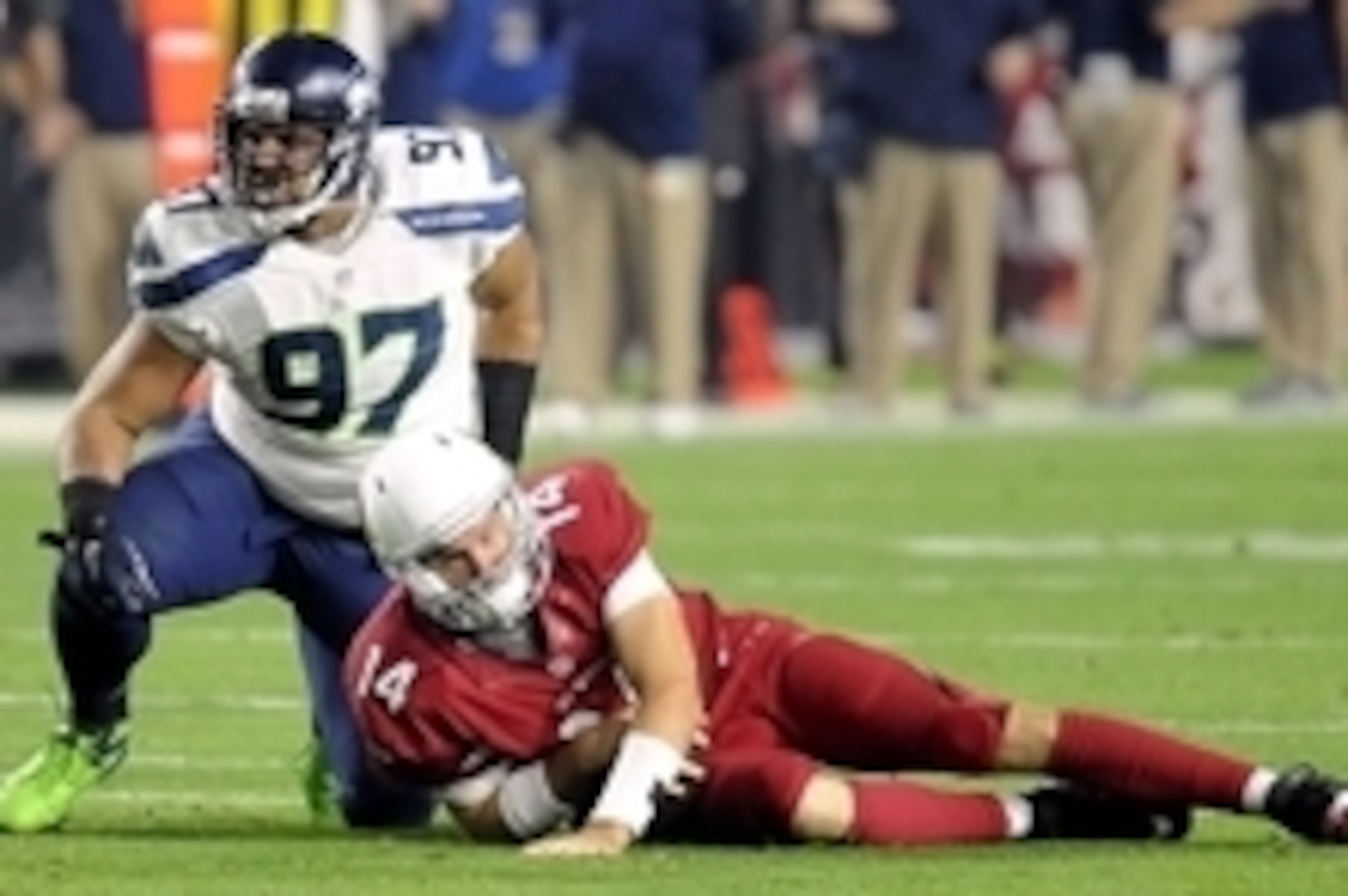 Dec 21, 2014; Glendale, AZ, USA; Seattle Seahawks defensive tackle Jordan Hill (97) kneels over Arizona Cardinals quarterback Ryan Lindley (14) during the second half at University of Phoenix Stadium. The Seahawks won 35-6. Mandatory Credit: Joe Camporeal Dec 21, 2014; Glendale, AZ, USA; Seattle Seahawks defensive tackle Jordan Hill (97) kneels over Arizona Cardinals quarterback Ryan Lindley (14) during the second half at University of Phoenix Stadium. The Seahawks won 35-6. Mandatory Credit: Joe Camporeal