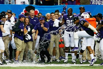ATLANTA, GA - DECEMBER 31:  Head coach Gary Patterson of the TCU Horned Frogs is dunked with a Gatorade cooler in the fourth quarter of their win over the Ole Miss Rebels during the Chik-fil-A Peach Bowl at Georgia Dome on December 31, 2014 in Atlanta, Ge