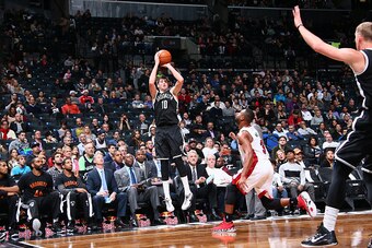 BROOKLYN, NY - DECEMBER 16:  Sergey Karasev #10 of the Brooklyn Nets shoots the ball against the Miami Heat during the game on December 16, 2014 at Barclays Center in Brooklyn, New York. NOTE TO USER: User expressly acknowledges and agrees that, by downlo