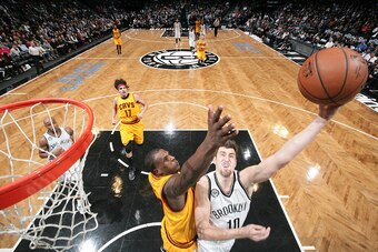 BROOKLYN, NY - DECEMBER 8:  Sergey Karasev #10 of the Brooklyn Nets shoots the ball against Dion Waiters #3 of the Cleveland Cavaliers during the game on December 8, 2014 at Barclays Center in Brooklyn, New York. NOTE TO USER: User expressly acknowledges 