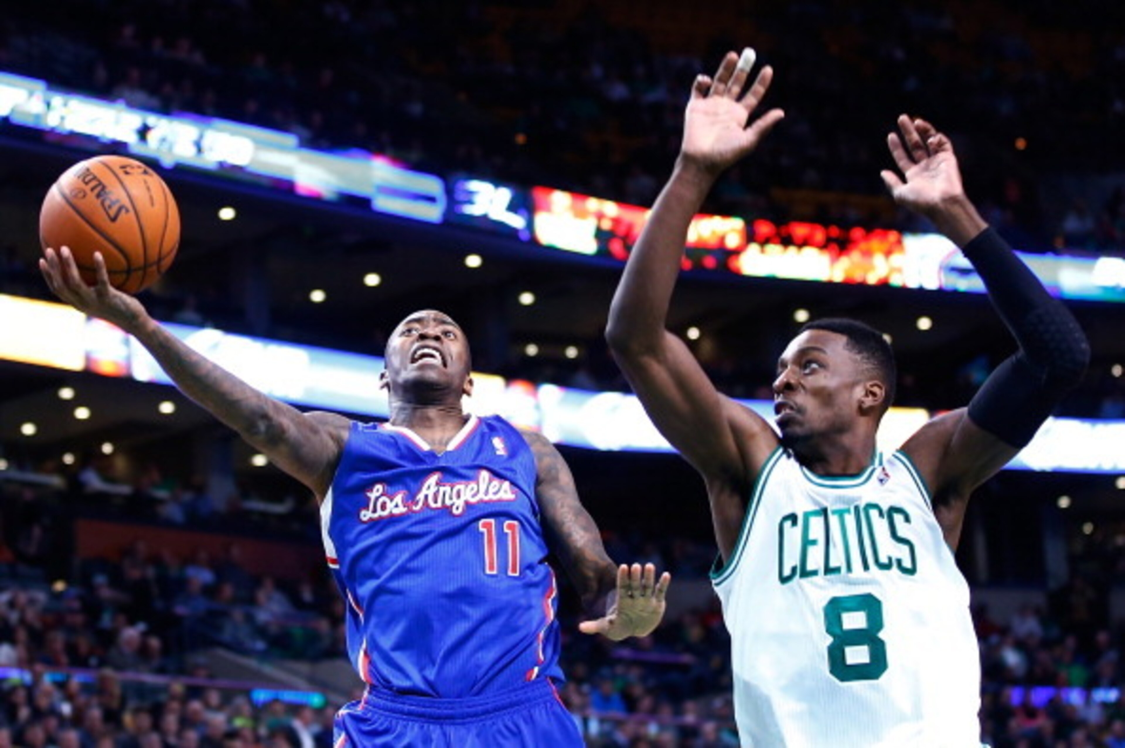 BOSTON, MA - DECEMBER 11: Jamal Crawford #11 of the Los Angeles Clippers goes up for a layup in front of Jeff Green #8 of the Boston Celtics in the second half during the game at TD Garden on December 11, 2013 in Boston, Massachusetts. NOTE TO USER: User 