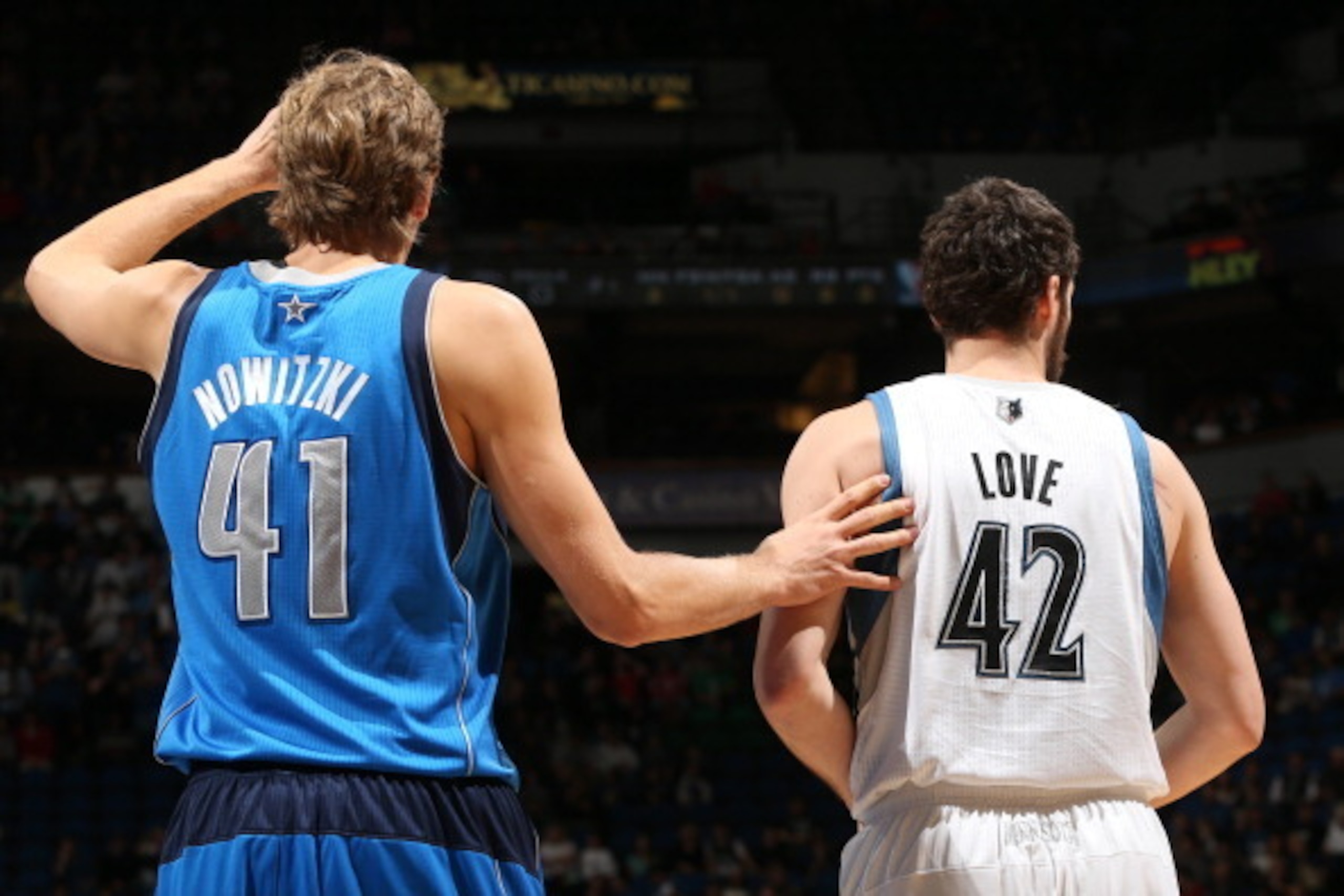 MINNEAPOLIS, MN - NOVEMBER 8:  Dirk Nowitzki #41 of the Dallas Mavericks and Kevin Love #42 of the Minnesota Timberwolves stand on the cout on November 8, 2013 at Target Center in Minneapolis, Minnesota. NOTE TO USER: User expressly acknowledges and agree