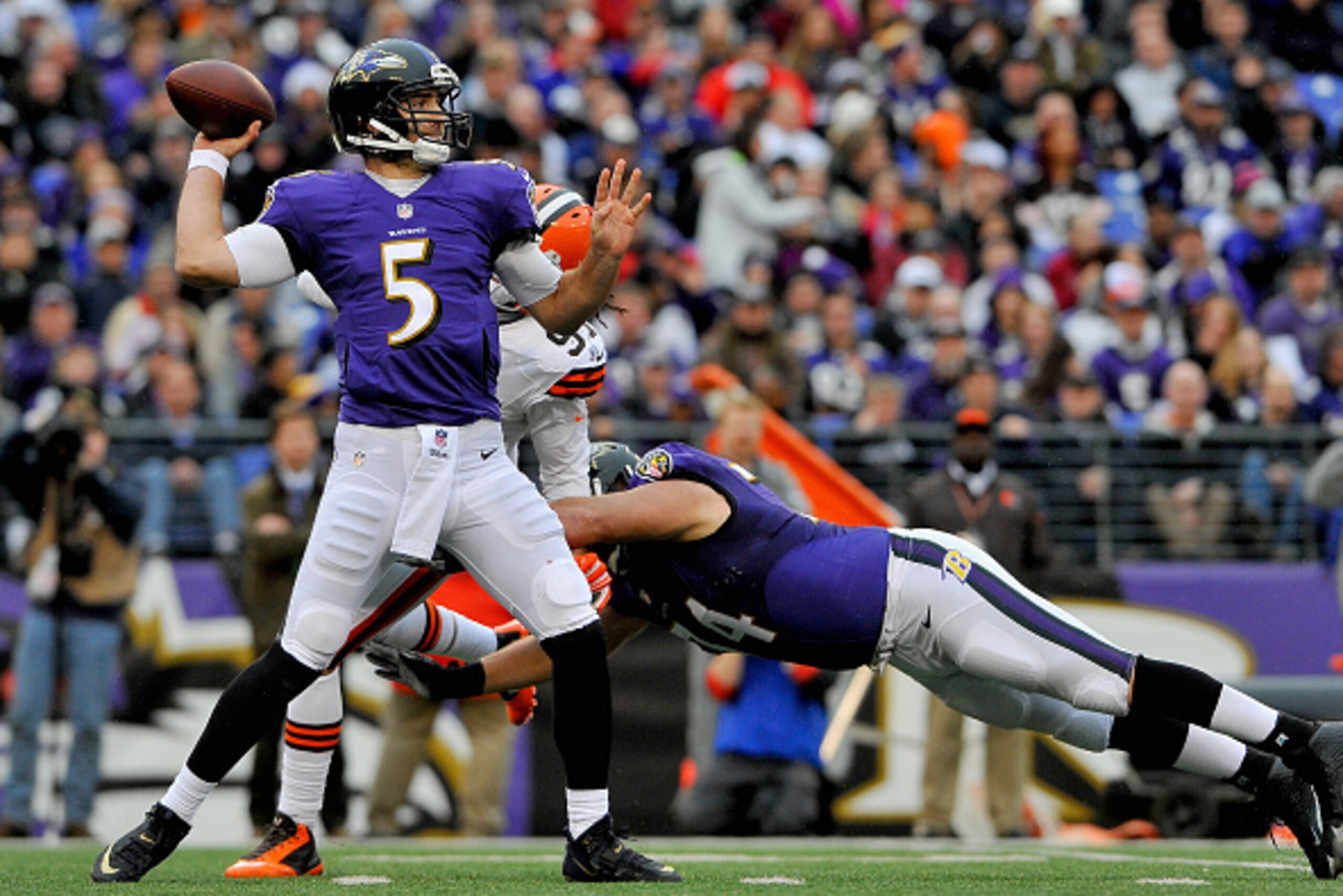 BALTIMORE, MD - DECEMBER 28: Quarterback Joe Flacco #5 of the Baltimore Ravens drops back to pass in the third quarter of a game against the Cleveland Browns at M&T Bank Stadium on December 28, 2014 in Baltimore, Maryland.  (Photo by Larry French/Getty Im