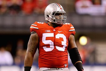 INDIANAPOLIS, IN - DECEMBER 06:  Defensive lineman Michael Bennett wears #53 to honor late teammate Kosta Karageorge of the Ohio State Buckeyes during the Big Ten Championship against the Wisconsin Badgers at Lucas Oil Stadium on December 6, 2014 in India