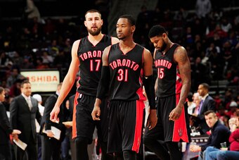 DETROIT, MI -  DECEMBER 19: Terrence Ross #31, Jonas Valanciunas #17 and Amir Johnson #15 of the Toronto Raptors during the game against the Toronto Raptors on December 19, 2014 at Palace of Auburn Hills in Detroit, Michigan. NOTE TO USER: User expressly 