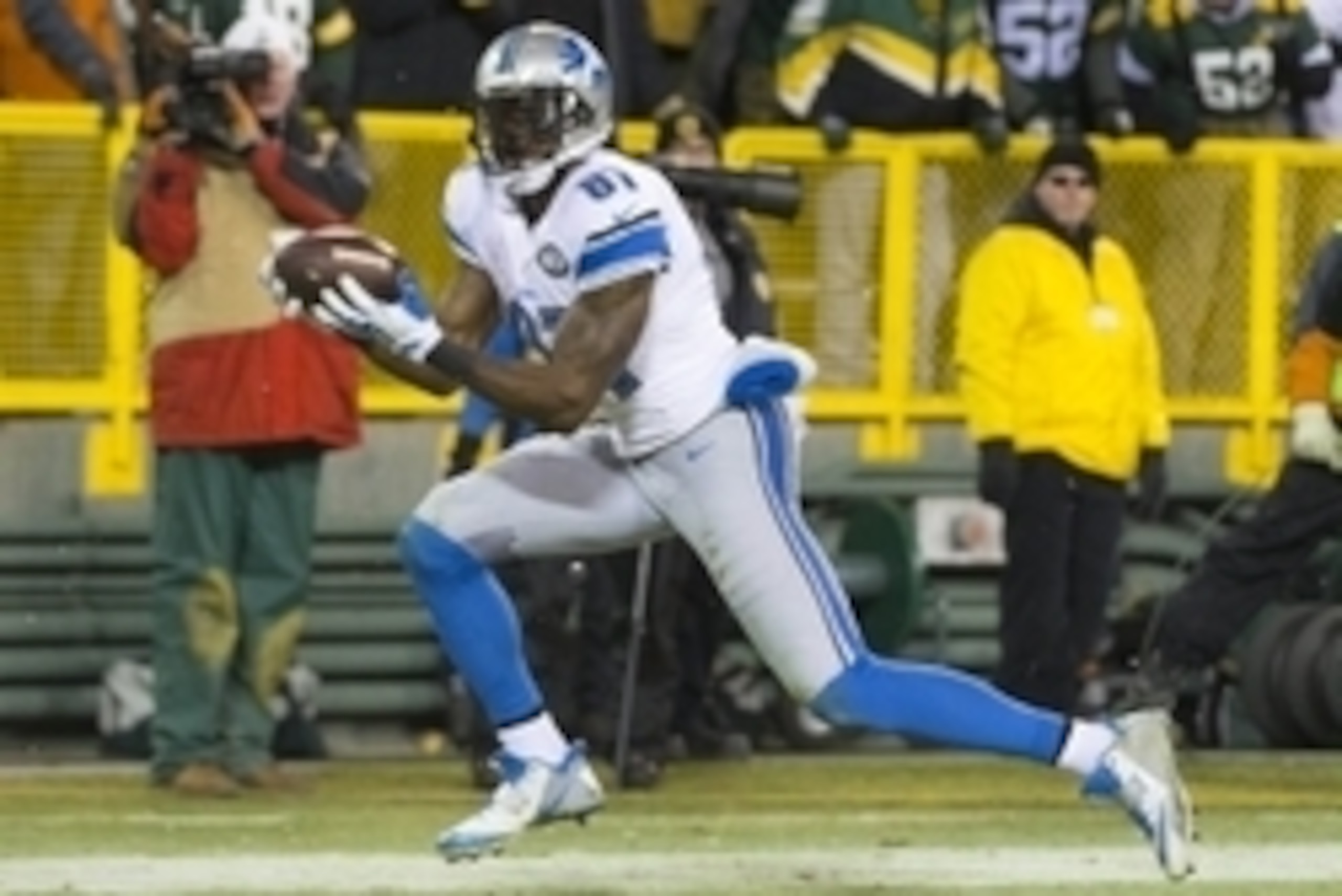 Dec 28, 2014; Green Bay, WI, USA; Detroit Lions wide receiver Calvin Johnson (81) catches a touchdown pass during the third quarter against the Green Bay Packers at Lambeau Field.  Green Bay won 30-20.  Mandatory Credit: Jeff Hanisch-USA TODAY Sports