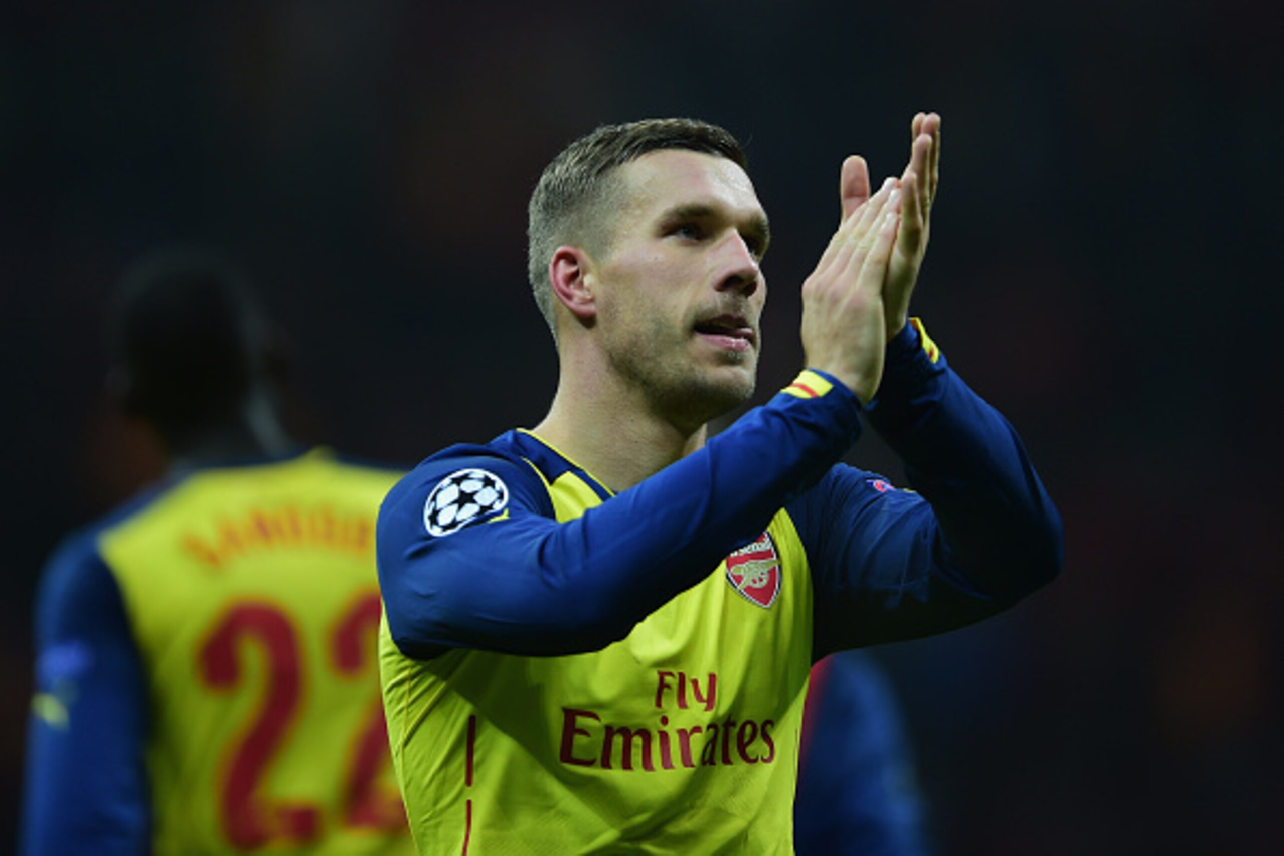 ISTANBUL, TURKEY - DECEMBER 09:  Lukas Podolski of Arsenal applauds the crowd after victory in the UEFA Champions League Group D match between Galatasaray AS and Arsenal FC at Ali Sami Yen Arena on December 9, 2014 in Istanbul, Turkey.  (Photo by Jamie Mc