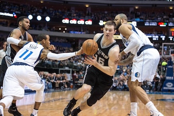 Dec 20, 2014; Dallas, TX, USA; Dallas Mavericks guard Monta Ellis (11) knocks the ball away from San Antonio Spurs forward Aron Baynes (16) during the first quarter at American Airlines Center. Mandatory Credit: Jerome Miron-USA TODAY Sports