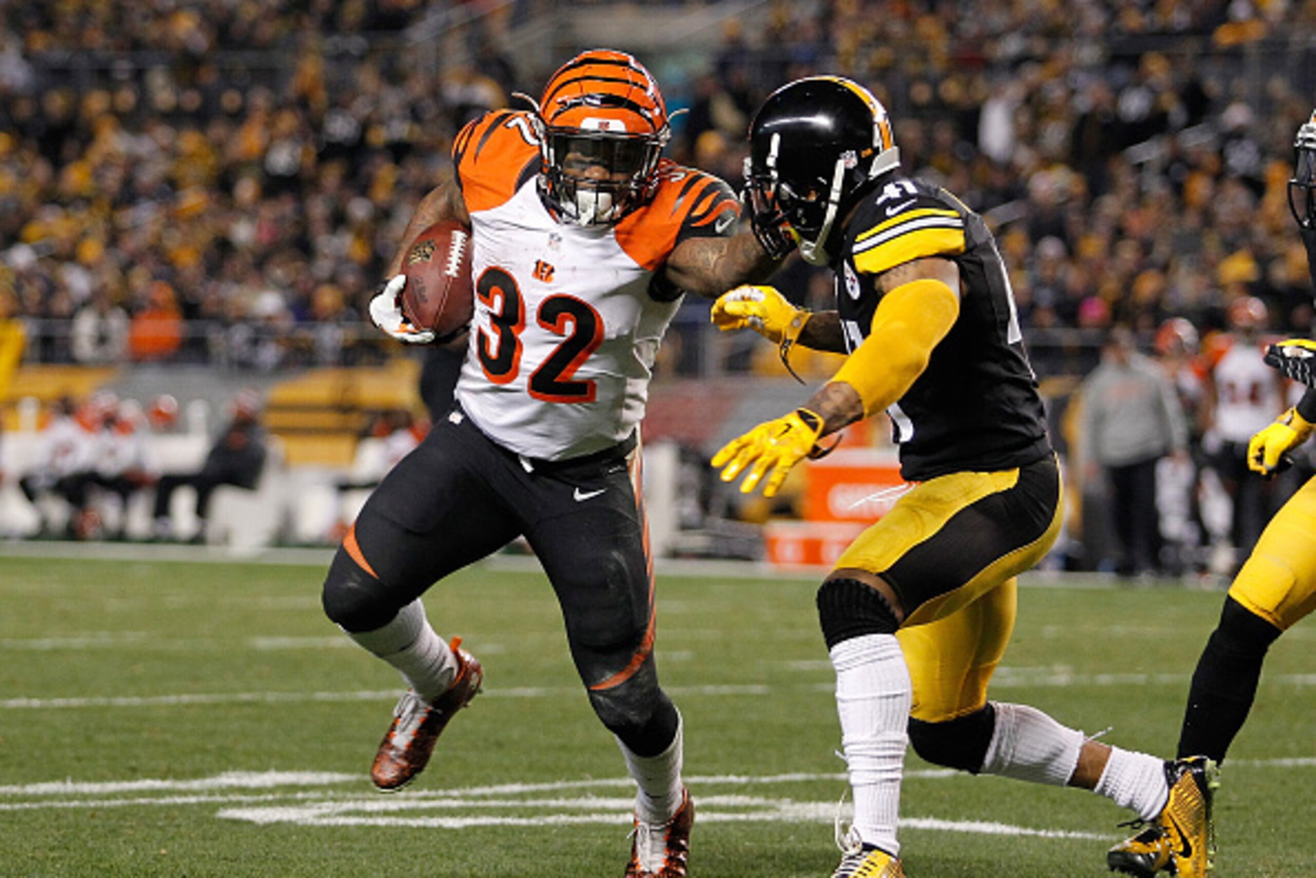 PITTSBURGH, PA - DECEMBER 28:  Jeremy Hill #32 of the Cincinnati Bengals carries the ball in front of Antwon Blake #41 of the Pittsburgh Steelers during the third quarter at Heinz Field on December 28, 2014 in Pittsburgh, Pennsylvania.  (Photo by Justin K