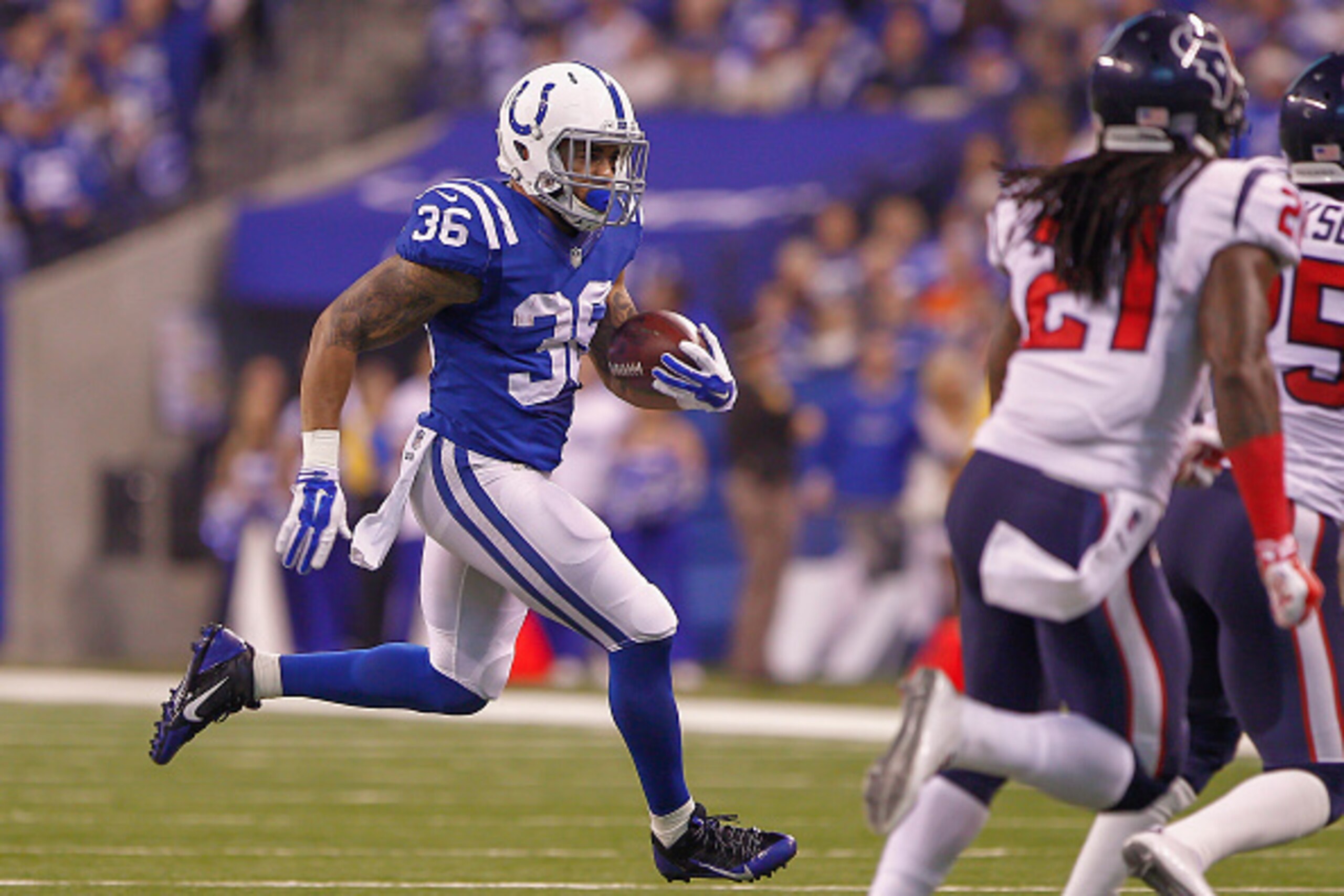 INDIANAPOLIS, IN - DECEMBER  14: Dan Herron #36 of the Indianapolis Colts runs the ball against the Houston Texans at Lucas Oil Stadium on December 14, 2014 in Indianapolis, Indiana. (Photo by Michael Hickey/Getty Images)