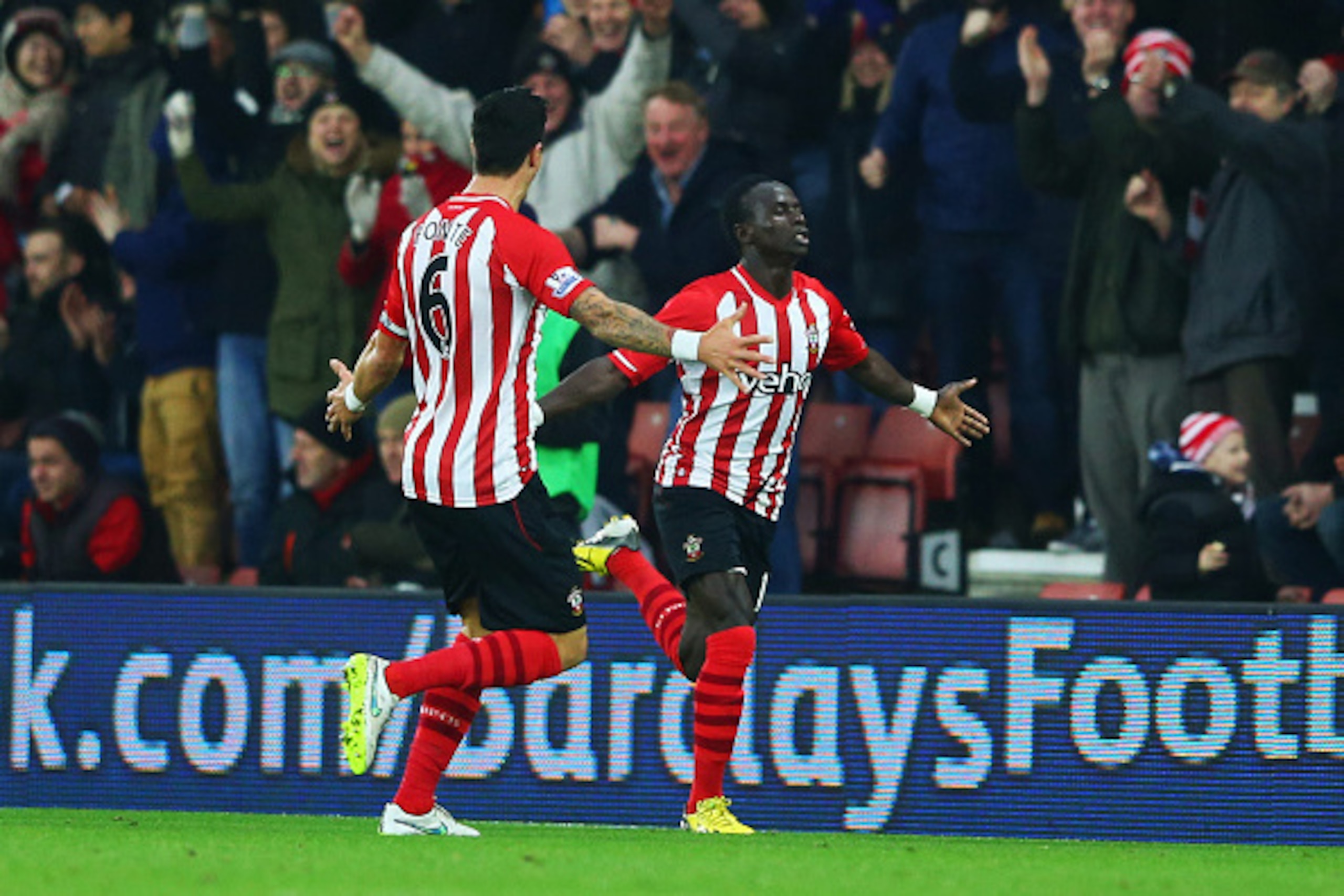 SOUTHAMPTON, ENGLAND - JANUARY 01:  Sadio Mane of Southampton (R) celebrates with team mate Jose Fonte (L) as he scores their first goal during the Barclays Premier League match between Southampton and Arsenal at St Mary's Stadium on January 1, 2015 in So