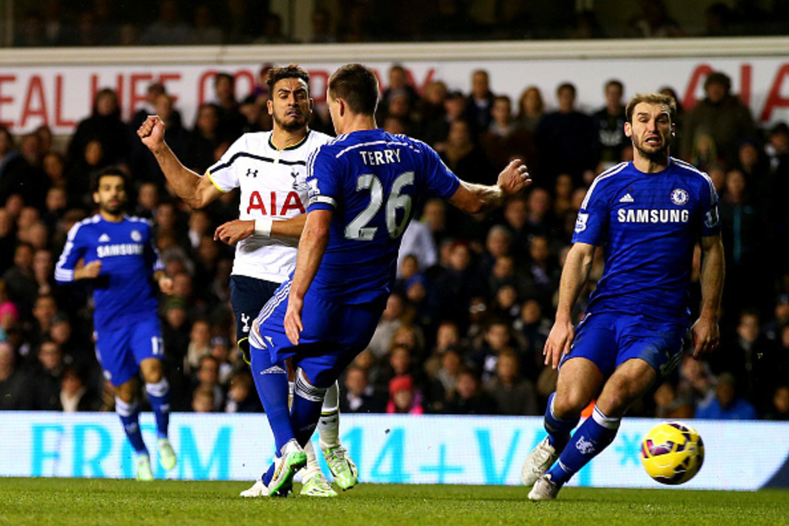 LONDON, ENGLAND - JANUARY 01:  Nacer Chadli of Spurs scores his team's fifth goal during the Barclays Premier League match between Tottenham Hotspur and Chelsea at White Hart Lane on January 1, 2015 in London, England.  (Photo by Clive Rose/Getty Images)