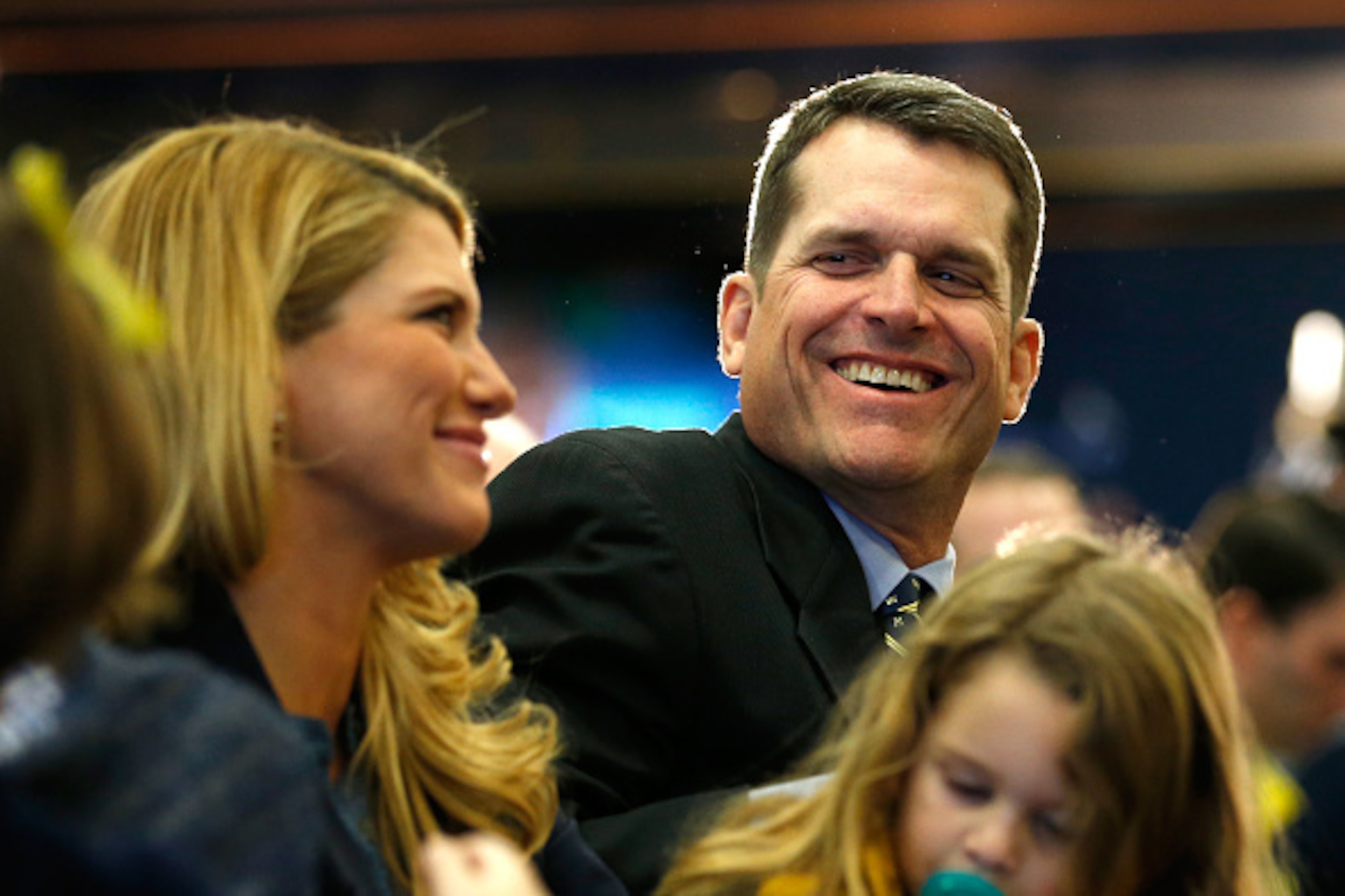 ANN ARBOR, MI - DECEMBER 30: Jim Harbaugh looks on with his family as he is introduced as the new Head Coach of the University of Michigan football team at the Junge Family Champions Center on December 30, 2014 in Ann Arbor, Michigan. (Photo by Gregory ANN ARBOR, MI - DECEMBER 30: Jim Harbaugh looks on with his family as he is introduced as the new Head Coach of the University of Michigan football team at the Junge Family Champions Center on December 30, 2014 in Ann Arbor, Michigan. (Photo by Gregory