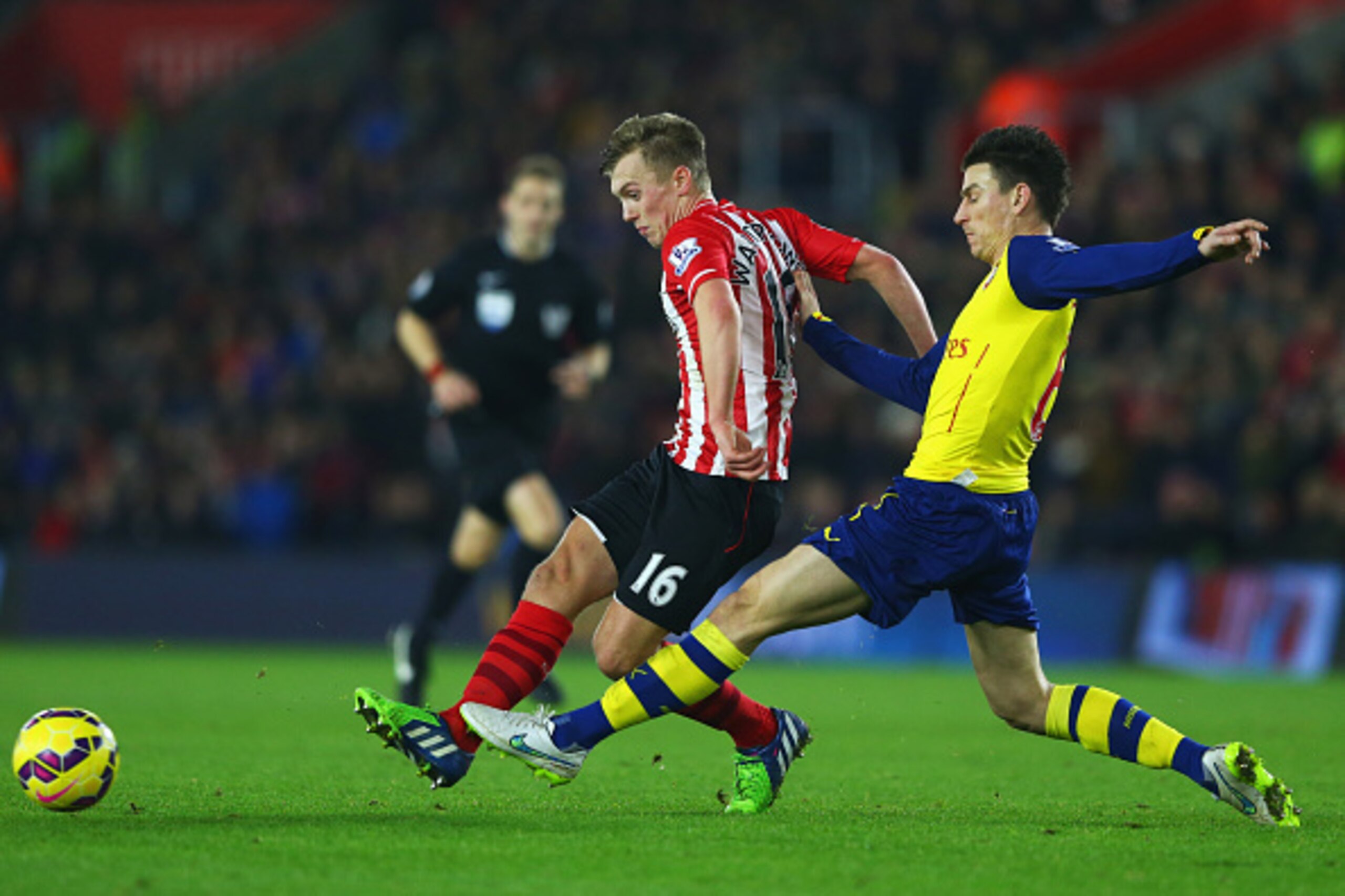 SOUTHAMPTON, ENGLAND - JANUARY 01:  James Ward-Prowse of Southampton evades Laurent Koscielny of Arsenal during the Barclays Premier League match between Southampton and Arsenal at St Mary's Stadium on January 1, 2015 in Southampton, England.  (Photo by M