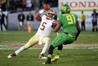 Jan 1, 2015; Pasadena, CA, USA; Florida State Seminoles quarterback Jameis Winston (5) scrambles under pressure from Oregon Ducks linebacker Tony Washington (91) in the 2015 Rose Bowl college football game at Rose Bowl. Mandatory Credit: Jayne Kamin-Oncea