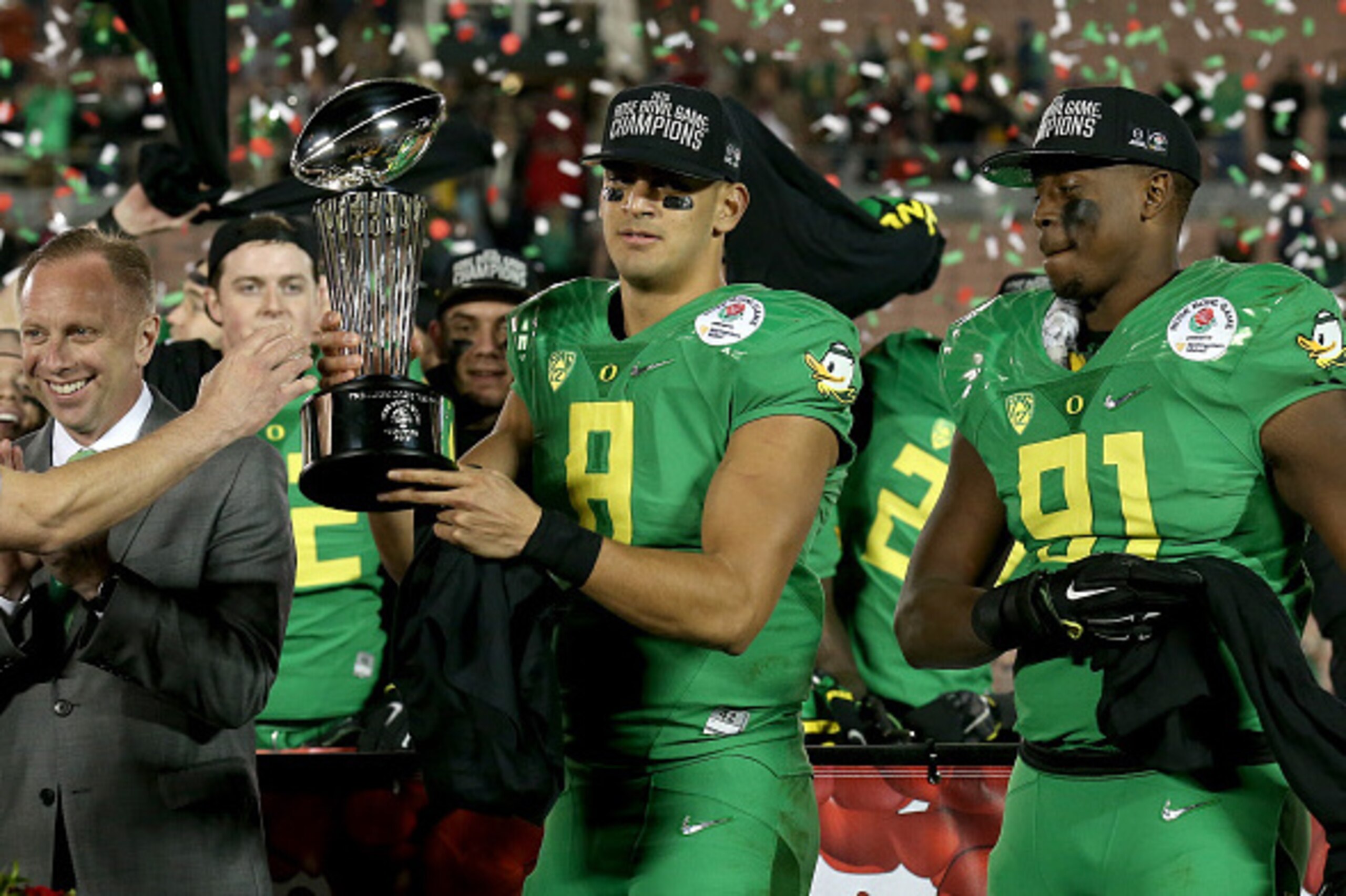 PASADENA, CA - JANUARY 01:  Quarterback Marcus Mariota #8 of the Oregon Ducks receives the Leishman Trophy after defeating the Florida State Seminoles 59-20 in the College Football Playoff Semifinal at the Rose Bowl Game presented by Northwestern Mutual a