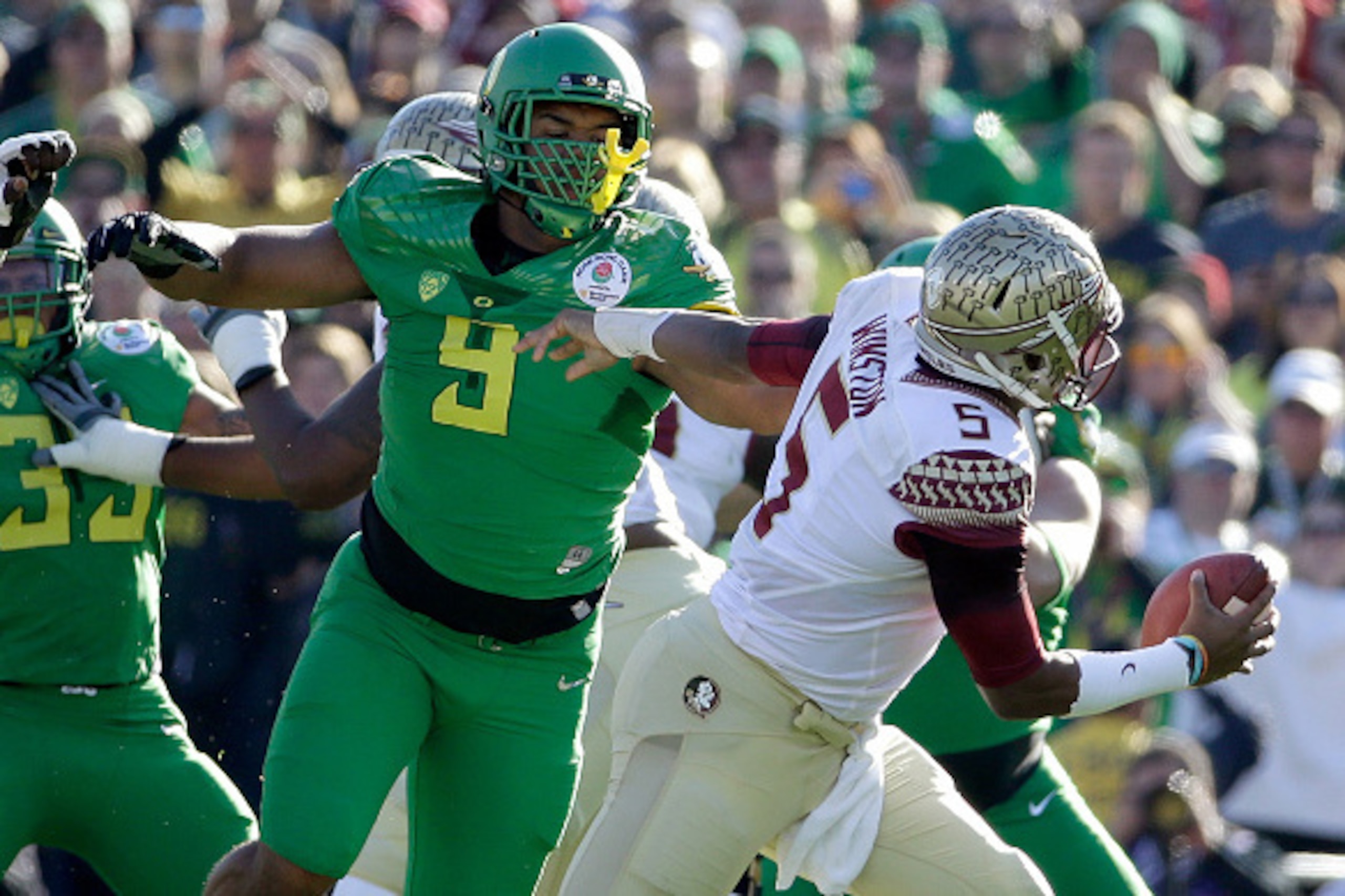 PASADENA, CA - JANUARY 01:  Defensive lineman Arik Armstead #9 of the Oregon Ducks pressures quarterback Jameis Winston #5 of the Florida State Seminoles during the first quarter of the College Football Playoff Semifinal at the Rose Bowl Game presented by