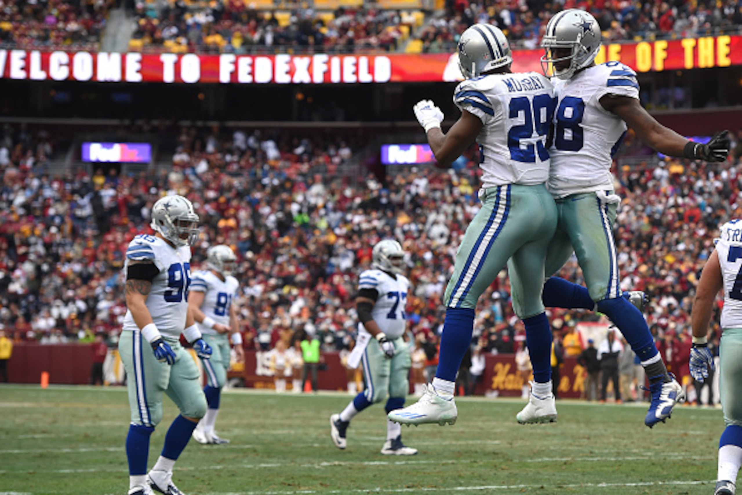 LANDOVER, MD - DECEMBER 28: Running back DeMarco Murray #29 of the Dallas Cowboys celebrates with teammate Dez Bryant #88  after scoring a second quarter touchdown against the Washington Redskins at FedExField on December 28, 2014 in Landover, Maryland. (