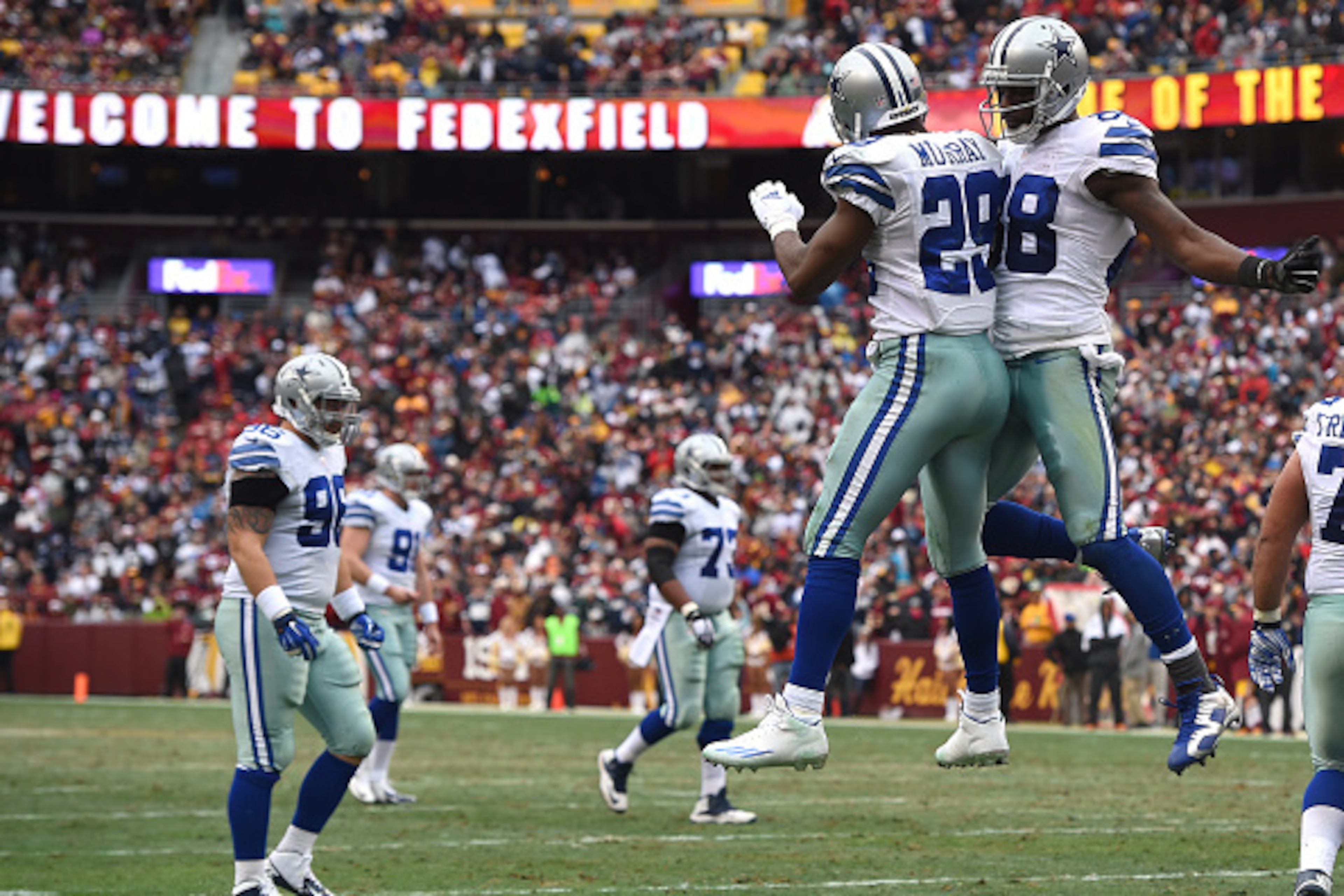 LANDOVER, MD - DECEMBER 28: Running back DeMarco Murray #29 of the Dallas Cowboys celebrates with teammate Dez Bryant #88 after scoring a second quarter touchdown against the Washington Redskins at FedExField on December 28, 2014 in Landover, Maryland. ( LANDOVER, MD - DECEMBER 28: Running back DeMarco Murray #29 of the Dallas Cowboys celebrates with teammate Dez Bryant #88 after scoring a second quarter touchdown against the Washington Redskins at FedExField on December 28, 2014 in Landover, Maryland. (