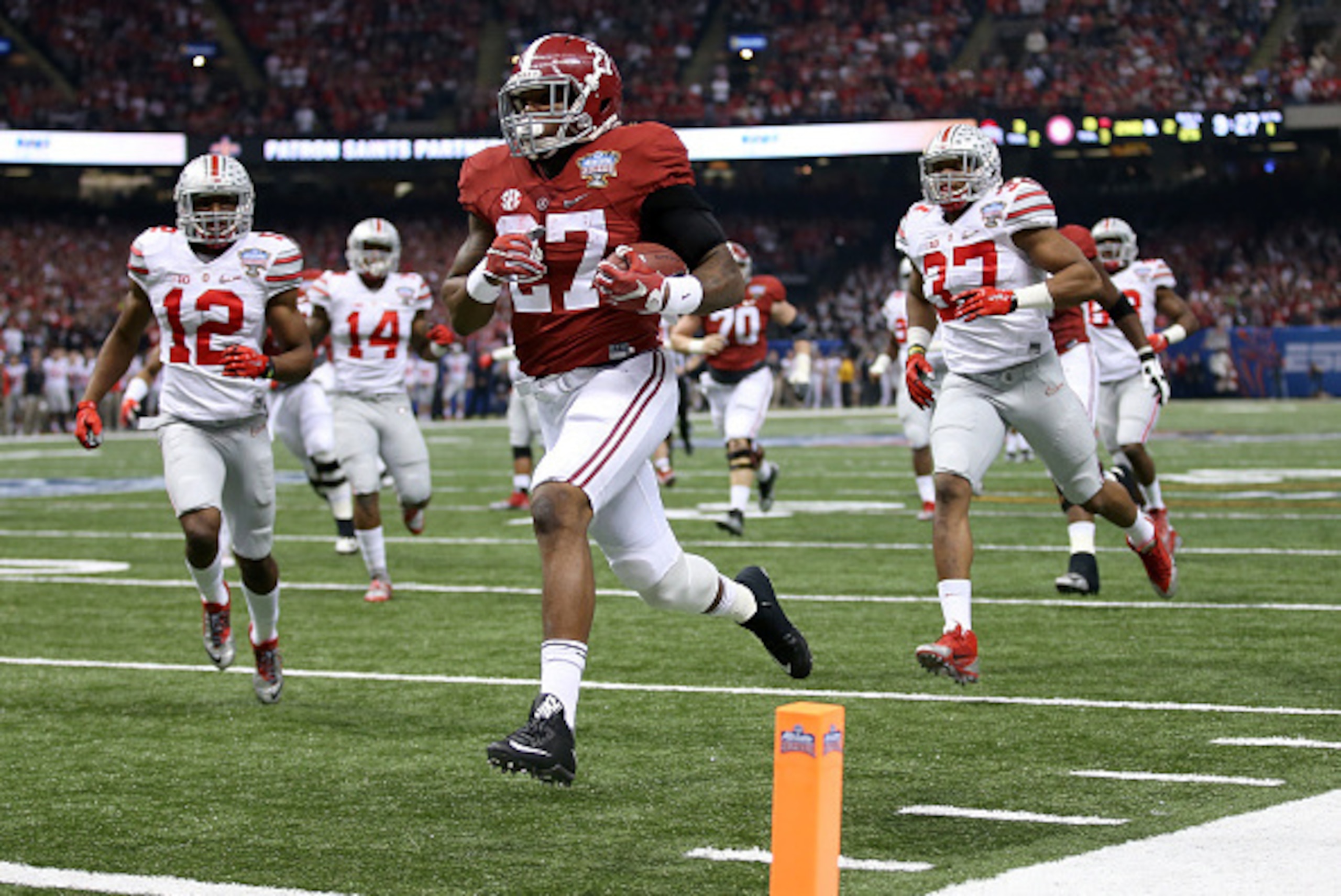 NEW ORLEANS, LA - JANUARY 01:  Derrick Henry #27 of the Alabama Crimson Tide scores a 25 yard touchdown in the first quarter against the Ohio State Buckeyes during the All State Sugar Bowl at the Mercedes-Benz Superdome on January 1, 2015 in New Orleans, 