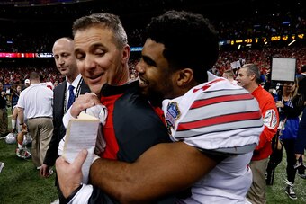 NEW ORLEANS, LA - JANUARY 01:  Head coach Urban Meyer of the Ohio State Buckeyes celebrates with Ezekiel Elliott #15 after defeating the Alabama Crimson Tide in the All State Sugar Bowl at the Mercedes-Benz Superdome on January 1, 2015 in New Orleans, Lou