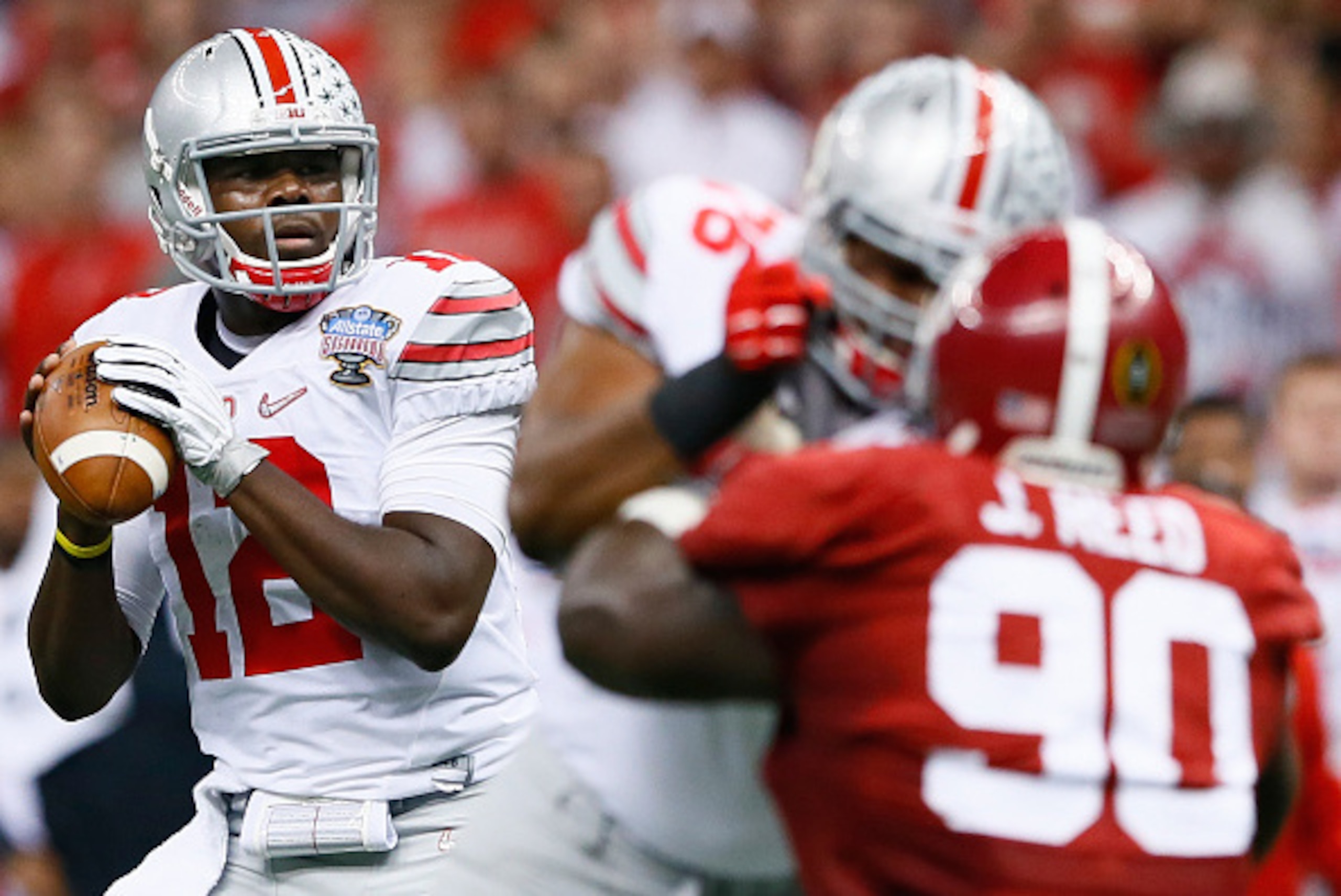 NEW ORLEANS, LA - JANUARY 01:  Cardale Jones #12 of the Ohio State Buckeyes throws a pass during the All State Sugar Bowl against Alabama Crimson Tide at the Mercedes-Benz Superdome on January 1, 2015 in New Orleans, Louisiana.  (Photo by Kevin C. Cox/Get