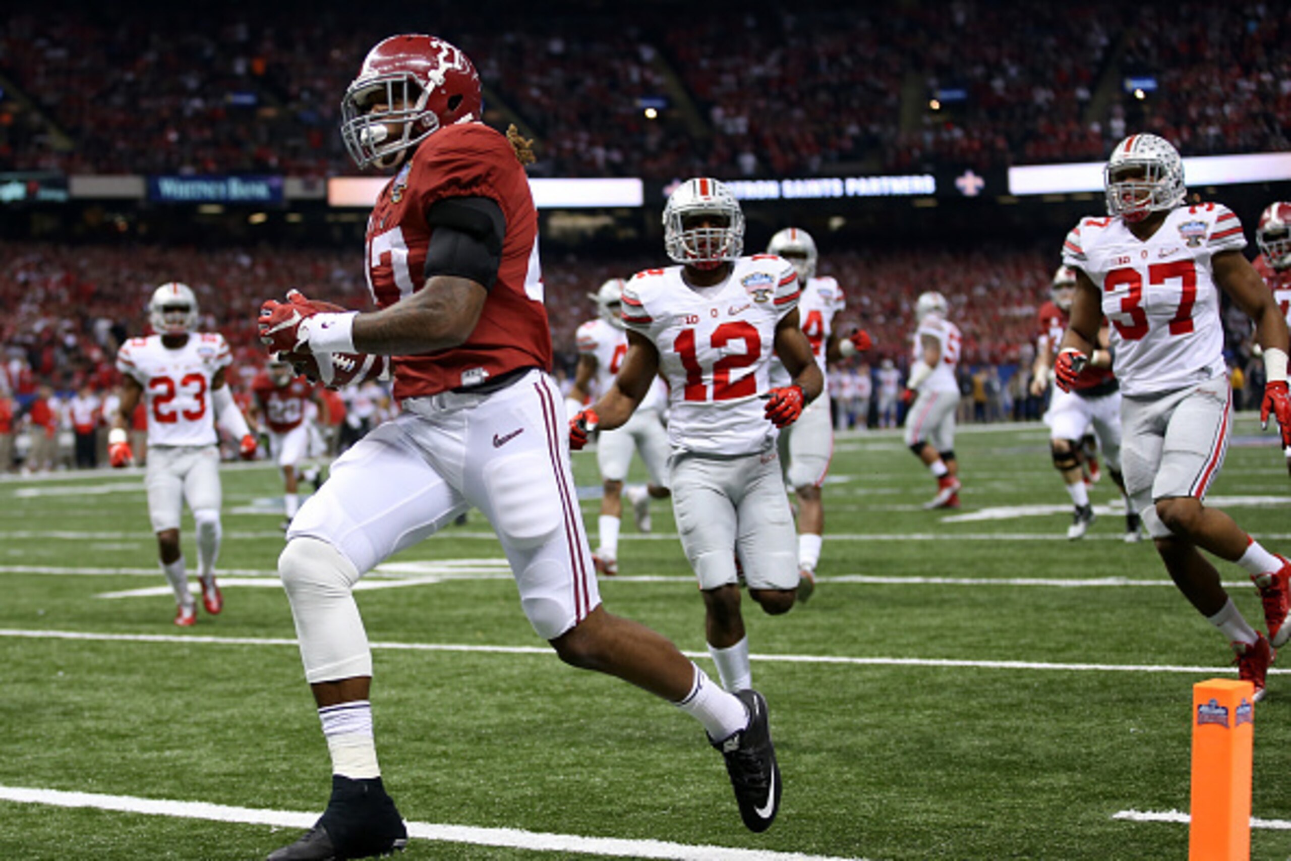 NEW ORLEANS, LA - JANUARY 01:  Derrick Henry #27 of the Alabama Crimson Tide scores a 25 yard touchdown in the first quarter against the Ohio State Buckeyes during the All State Sugar Bowl at the Mercedes-Benz Superdome on January 1, 2015 in New Orleans, 