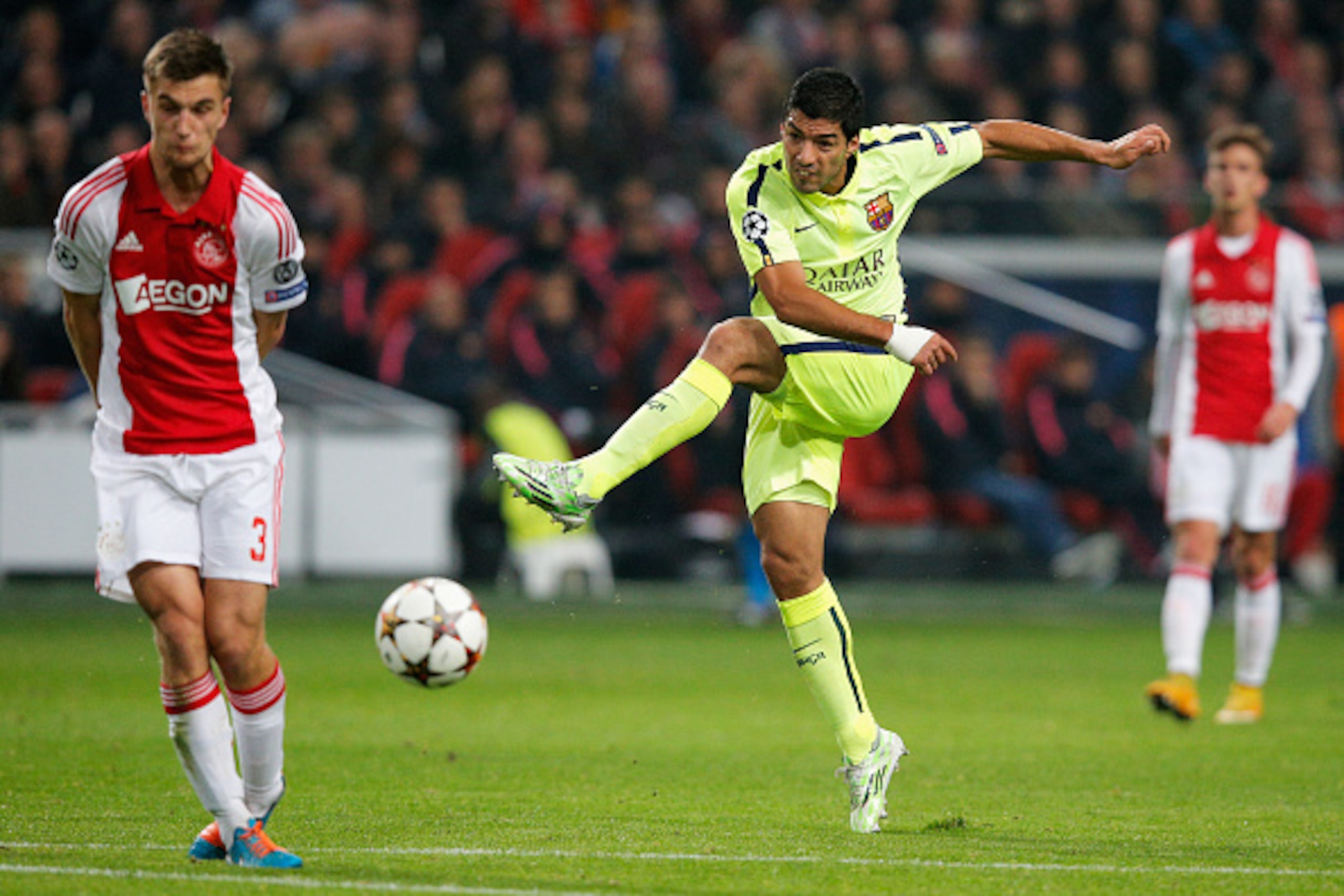 AMSTERDAM, NETHERLANDS - NOVEMBER 05:  Luis Suarez of Barcelona shoots on goal during the UEFA Champions League Group F match between AFC Ajax and FC Barcelona at The Amsterdam Arena on November 5, 2014 in Amsterdam, Netherlands.  (Photo by Dean Mouhtarop