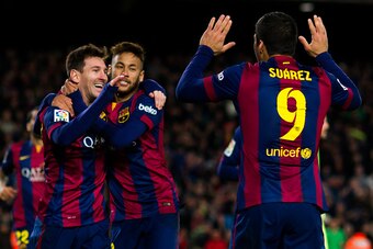 BARCELONA, SPAIN - DECEMBER 07: Lionel Messi (L) of FC Barcelona celebrates with his teammates Neymar Santos Jr (C) and Luis Suarez (R) after scoring his team's second goal during the La Liga match between FC Barcelona and RCD Espanyol at Camp Nou on Dece