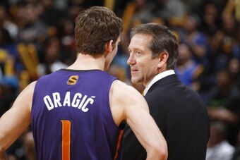 OAKLAND, CA - MARCH 9: Head coach Jeff Hornacek talks to Goran Dragic #1 of the Phoenix Suns while facing the Golden State Warriors on March 9, 2014 at Oracle Arena in Oakland, California. NOTE TO USER: User expressly acknowledges and agrees that, by down
